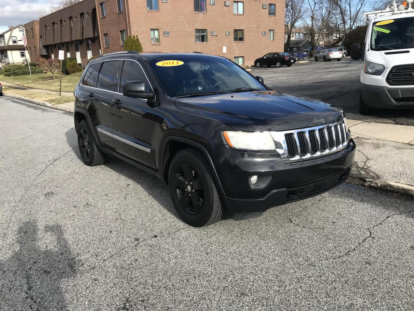 2011 Black /Black Jeep Grand Cherokee Laredo 4WD (1J4RR4GG9BC) with an 3.6L V6 DOHC 24V engine, 5-Speed Automatic transmission, located at 577 Chester Pike, Prospect Park, PA, 19076, (610) 237-1015, 39.886154, -75.302338 - Photo#1