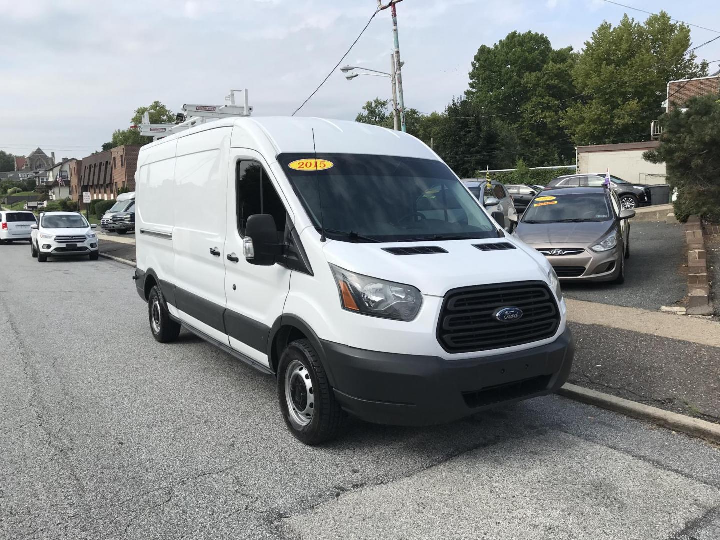 2015 White /Gray Ford Transit 150 Van Med. Roof 148-in. WB (1FTNE2CM7FK) with an 3.7L V6 DOHC 24V engine, 6-Speed Automatic transmission, located at 577 Chester Pike, Prospect Park, PA, 19076, (610) 237-1015, 39.886154, -75.302338 - 15 Ford Transit 150 Cargo Van: Medium Roof, ladder racks, bulkhead, new PA inspection, FLEET MAINTAINED! This vehicle comes inspected and has been given a bumper to bumper safety check. It is very clean, reliable, and well maintained. We offer a unique pay plan that is known for being the easiest - Photo#1