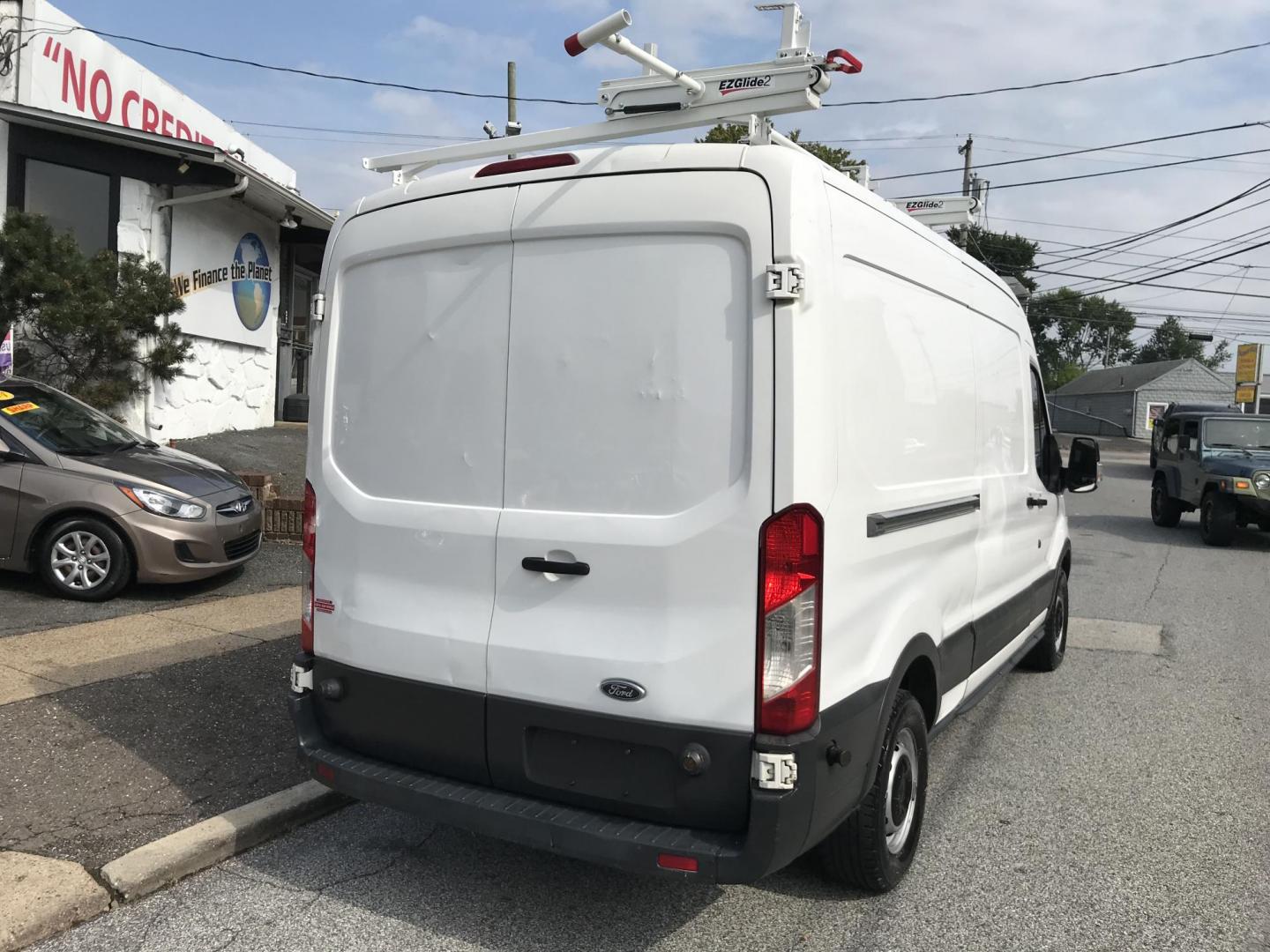 2015 White /Gray Ford Transit 150 Van Med. Roof 148-in. WB (1FTNE2CM7FK) with an 3.7L V6 DOHC 24V engine, 6-Speed Automatic transmission, located at 577 Chester Pike, Prospect Park, PA, 19076, (610) 237-1015, 39.886154, -75.302338 - 15 Ford Transit 150 Cargo Van: Medium Roof, ladder racks, bulkhead, new PA inspection, FLEET MAINTAINED! This vehicle comes inspected and has been given a bumper to bumper safety check. It is very clean, reliable, and well maintained. We offer a unique pay plan that is known for being the easiest - Photo#8