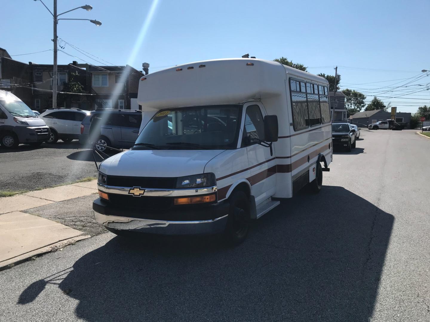 2012 White /Gray Chevrolet Express 3500 BUS (1GB3G3BLXC1) with an 6.6L engine, Automatic transmission, located at 577 Chester Pike, Prospect Park, PA, 19076, (610) 237-1015, 39.886154, -75.302338 - Photo#2