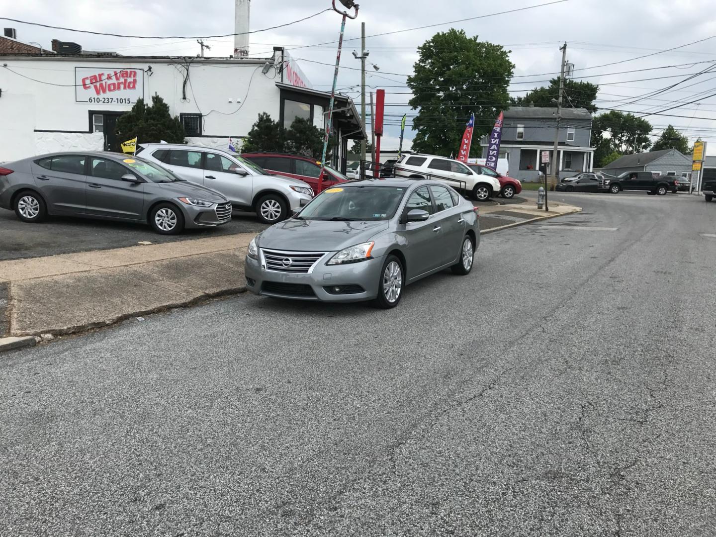 2013 Silver /Gray Nissan Sentra SL (3N1AB7AP8DL) with an 1.8 V4 engine, Automatic transmission, located at 577 Chester Pike, Prospect Park, PA, 19076, (610) 237-1015, 39.886154, -75.302338 - Photo#1