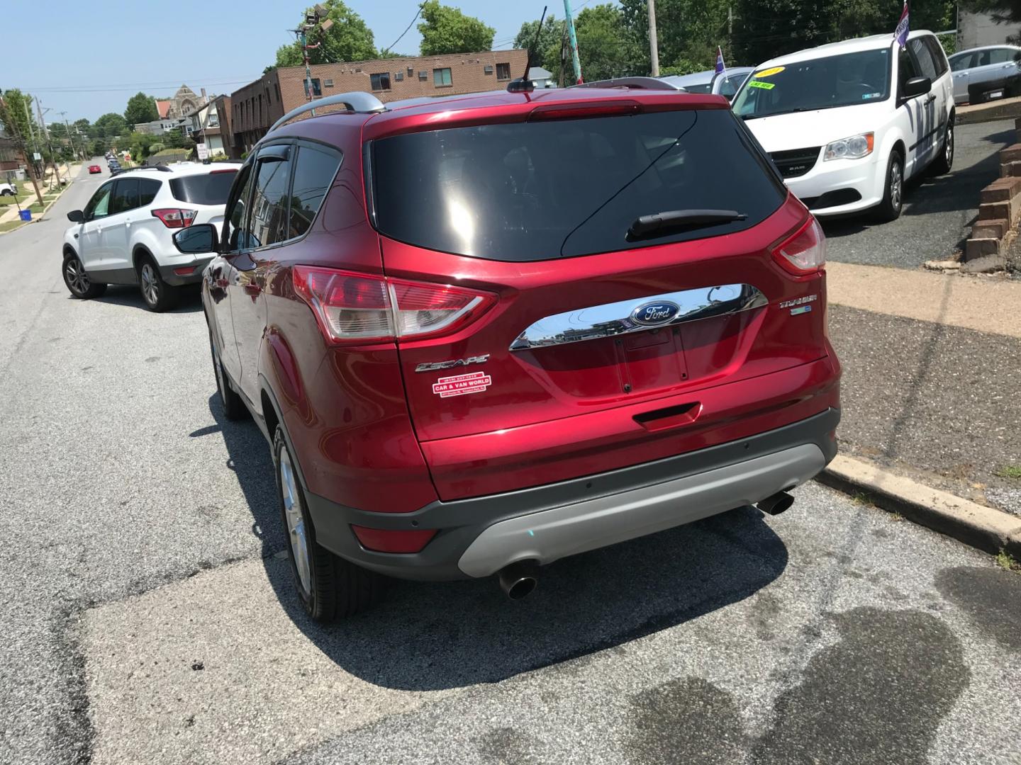 2014 Red /Gray Ford Escape Titanium (1FMCU9J99EU) with an 2.0 V4 engine, Automatic transmission, located at 577 Chester Pike, Prospect Park, PA, 19076, (610) 237-1015, 39.886154, -75.302338 - 2014 Ford Escape Titanium: 4x4, backup camera, new PA inspection, great on gas, SUPER CLEAN, runs LIKE NEW! This vehicle comes inspected and has been given a bumper to bumper safety check. It is very clean, reliable, and well maintained. We offer a unique pay plan that is known for being the easi - Photo#5