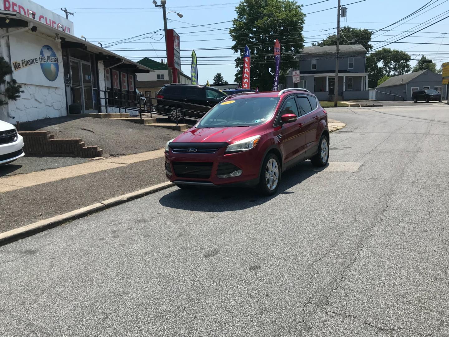 2014 Red /Gray Ford Escape Titanium (1FMCU9J99EU) with an 2.0 V4 engine, Automatic transmission, located at 577 Chester Pike, Prospect Park, PA, 19076, (610) 237-1015, 39.886154, -75.302338 - 2014 Ford Escape Titanium: 4x4, backup camera, new PA inspection, great on gas, SUPER CLEAN, runs LIKE NEW! This vehicle comes inspected and has been given a bumper to bumper safety check. It is very clean, reliable, and well maintained. We offer a unique pay plan that is known for being the easi - Photo#1