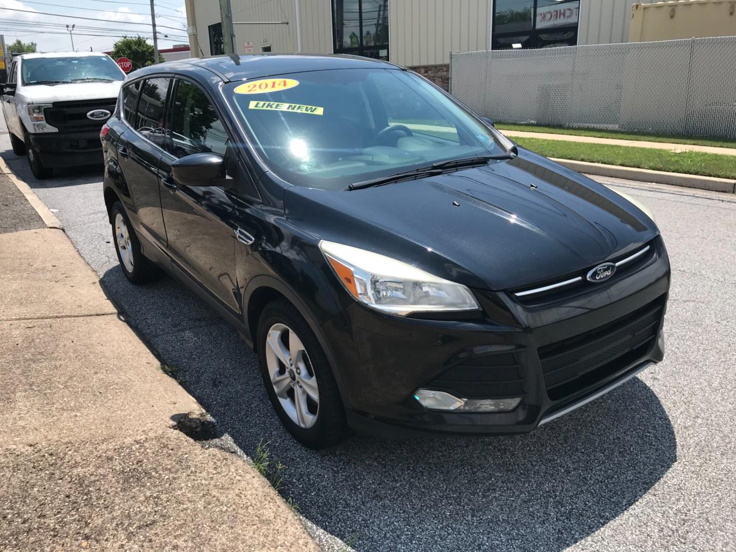 2014 Black /Black Ford Escape SE (1FMCU9GX3EU) with an 1.6 V4 engine, Automatic transmission, located at 577 Chester Pike, Prospect Park, PA, 19076, (610) 237-1015, 39.886154, -75.302338 - 2014 Ford Escape SE: 4x4, backup camera, new PA inspection, SUPER CLEAN, runs LIKE NEW! This vehicle comes inspected and has been given a bumper to bumper safety check. It is very clean, reliable, and well maintained. We offer a unique pay plan that is known for being the easiest and fastest fina - Photo#3