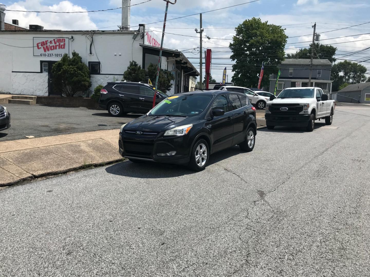 2014 Black /Black Ford Escape SE (1FMCU9GX3EU) with an 1.6 V4 engine, Automatic transmission, located at 577 Chester Pike, Prospect Park, PA, 19076, (610) 237-1015, 39.886154, -75.302338 - 2014 Ford Escape SE: 4x4, backup camera, new PA inspection, SUPER CLEAN, runs LIKE NEW! This vehicle comes inspected and has been given a bumper to bumper safety check. It is very clean, reliable, and well maintained. We offer a unique pay plan that is known for being the easiest and fastest fina - Photo#1