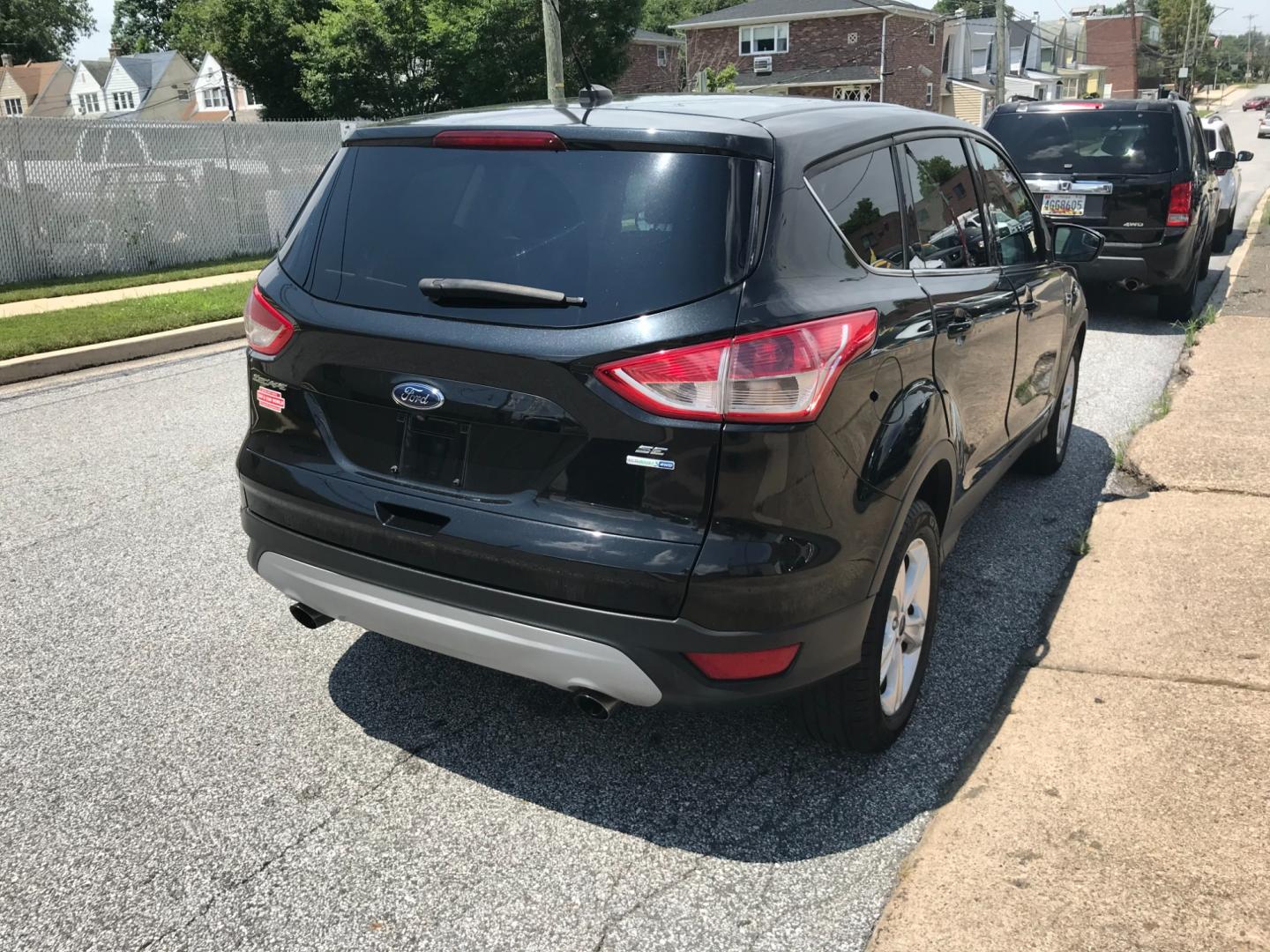 2014 Black /Black Ford Escape SE (1FMCU9GX3EU) with an 1.6 V4 engine, Automatic transmission, located at 577 Chester Pike, Prospect Park, PA, 19076, (610) 237-1015, 39.886154, -75.302338 - Photo#4