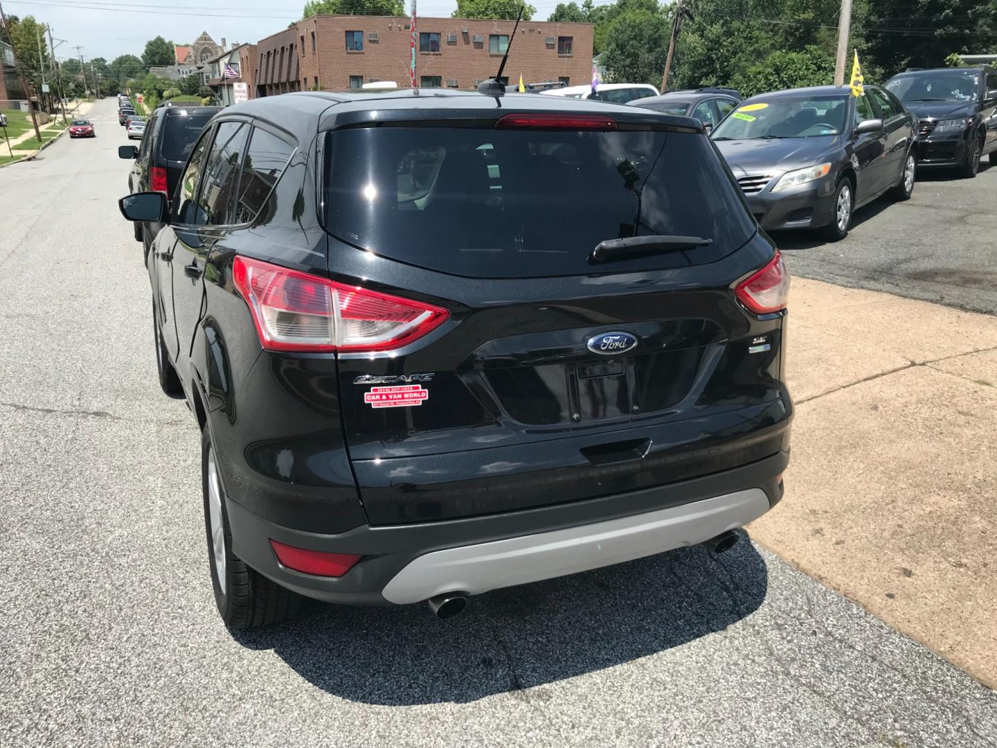 2014 Black /Black Ford Escape SE (1FMCU9GX3EU) with an 1.6 V4 engine, Automatic transmission, located at 577 Chester Pike, Prospect Park, PA, 19076, (610) 237-1015, 39.886154, -75.302338 - Photo#5