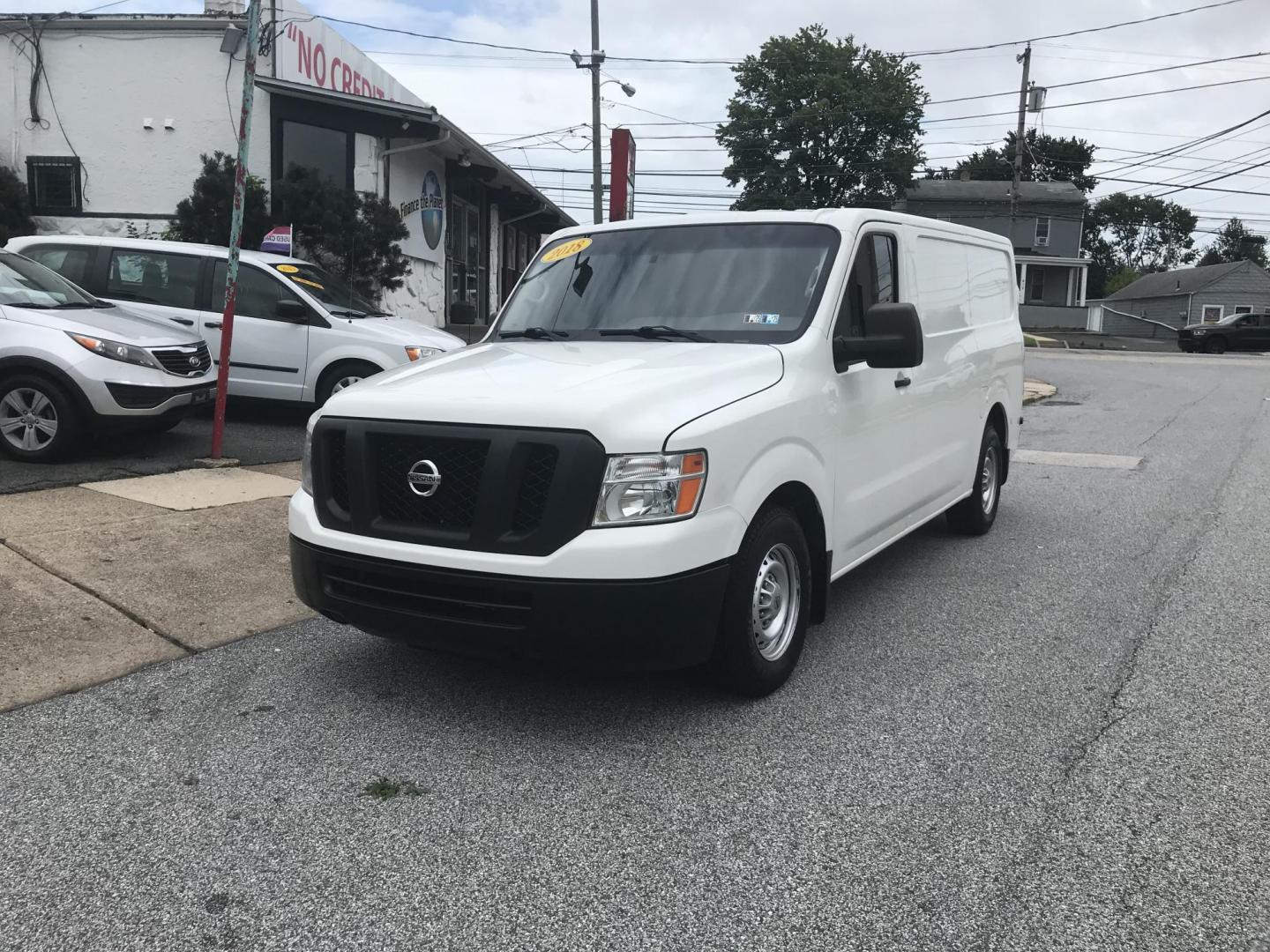 2018 White /Gray Nissan NV Cargo 1500 S (1N6BF0KM4JN) with an 4.0L V6 engine, 5A transmission, located at 577 Chester Pike, Prospect Park, PA, 19076, (610) 237-1015, 39.886154, -75.302338 - Photo#1