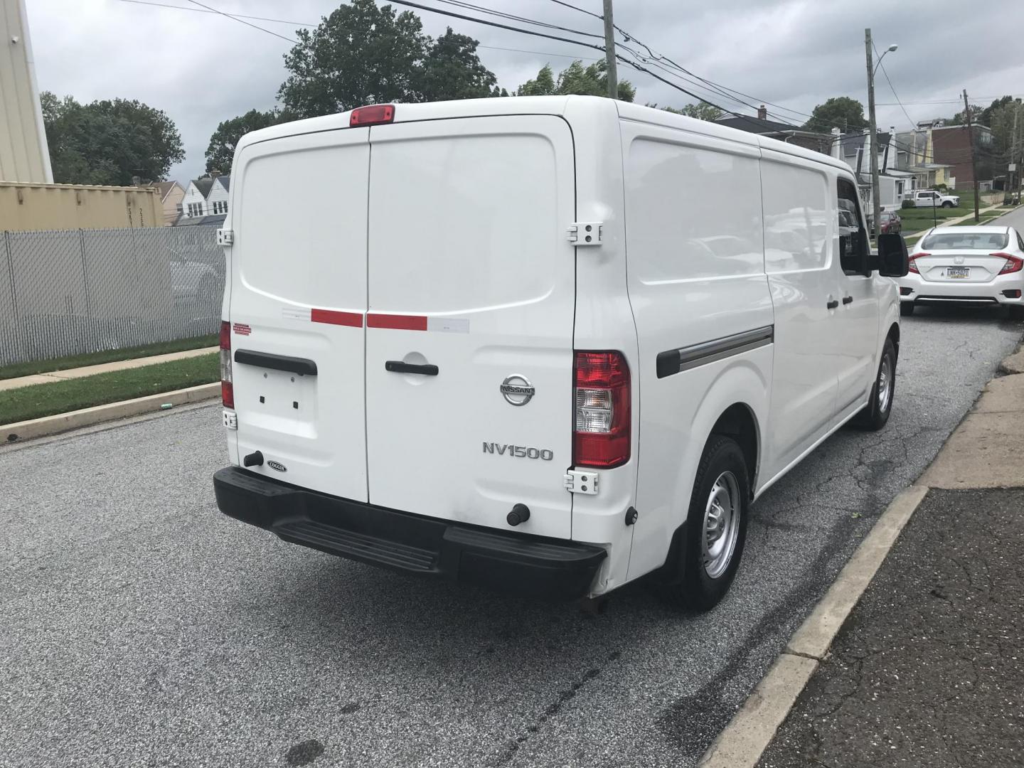 2018 White /Gray Nissan NV Cargo 1500 S (1N6BF0KM4JN) with an 4.0L V6 engine, 5A transmission, located at 577 Chester Pike, Prospect Park, PA, 19076, (610) 237-1015, 39.886154, -75.302338 - Photo#4