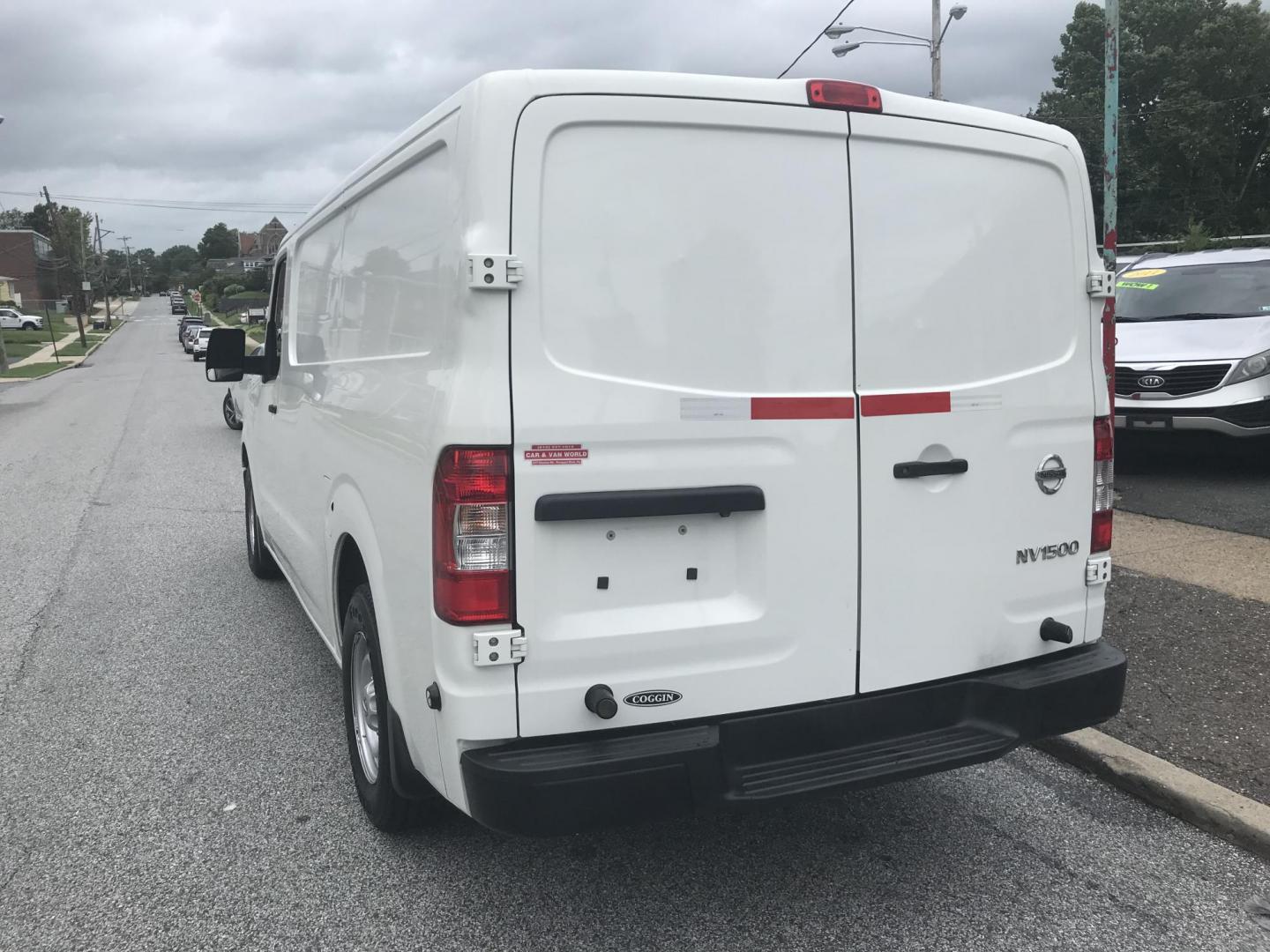 2018 White /Gray Nissan NV Cargo 1500 S (1N6BF0KM4JN) with an 4.0L V6 engine, 5A transmission, located at 577 Chester Pike, Prospect Park, PA, 19076, (610) 237-1015, 39.886154, -75.302338 - Photo#5