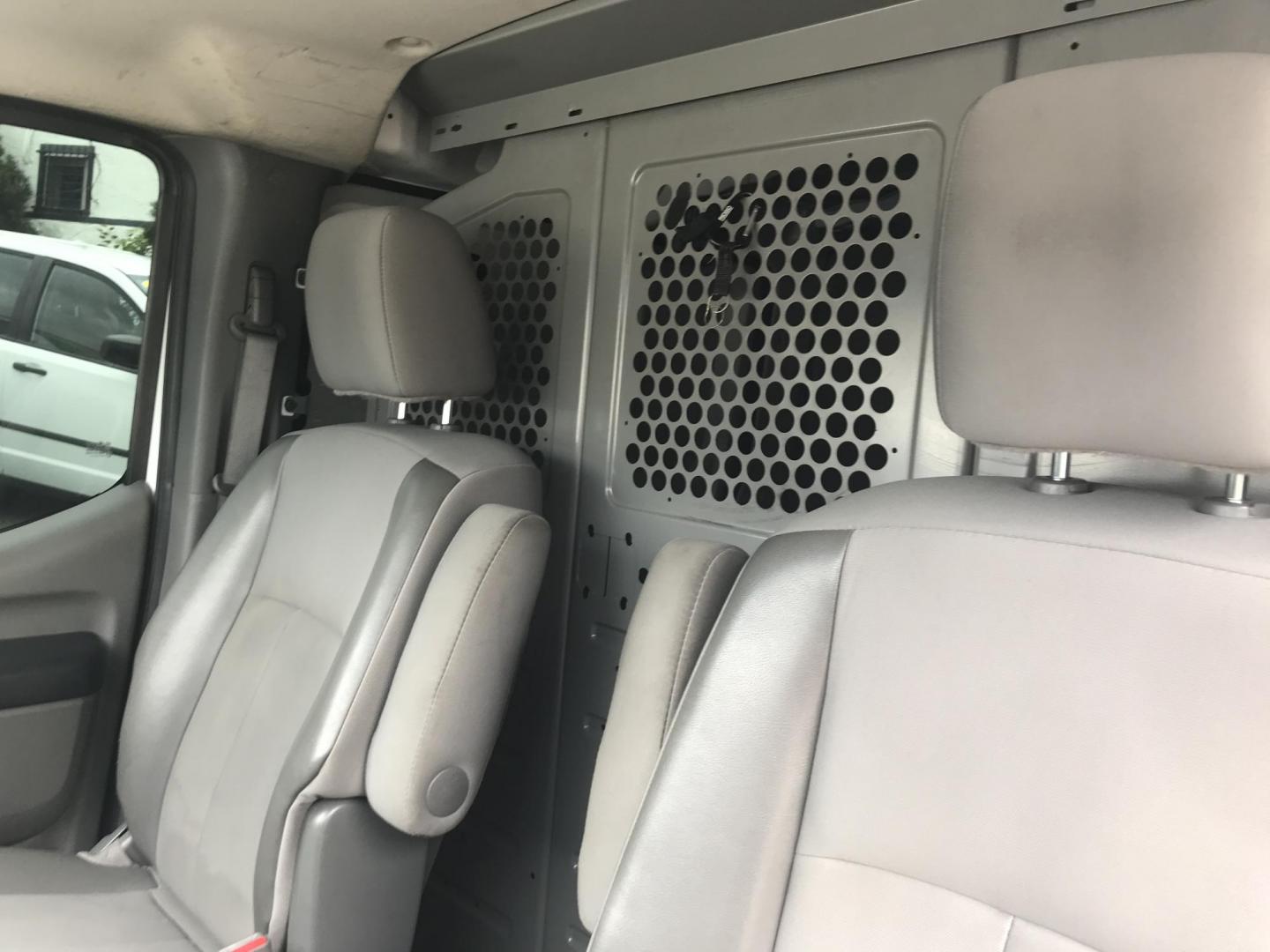 2018 White /Gray Nissan NV Cargo 1500 S (1N6BF0KM4JN) with an 4.0L V6 engine, 5A transmission, located at 577 Chester Pike, Prospect Park, PA, 19076, (610) 237-1015, 39.886154, -75.302338 - Photo#9