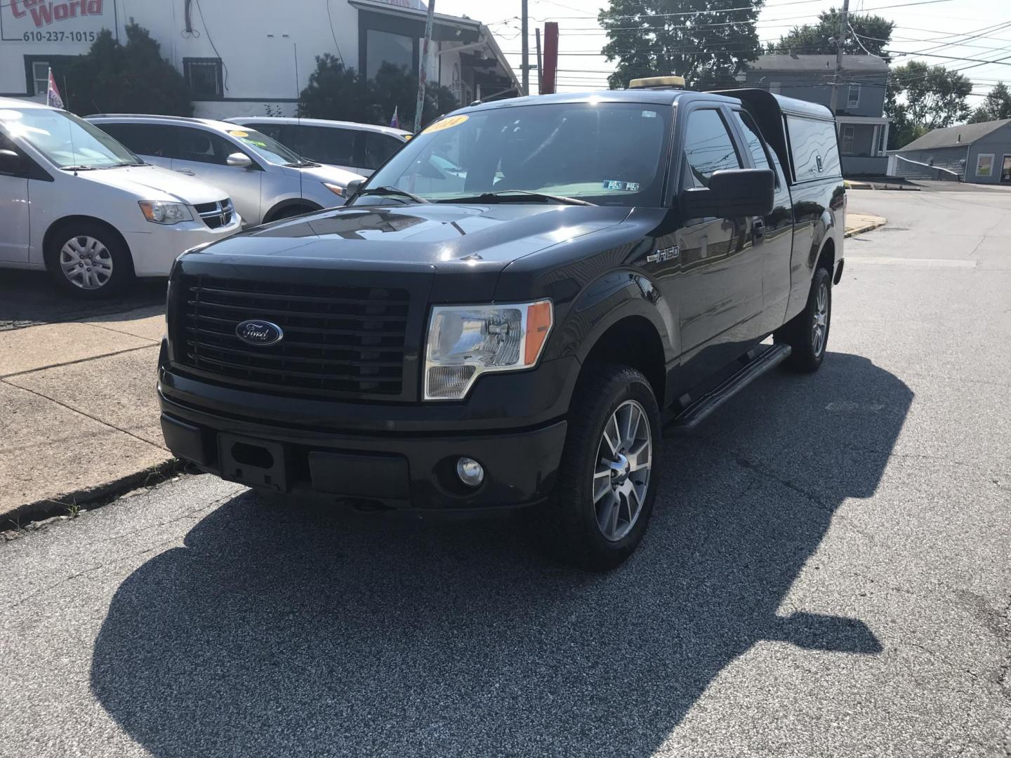 2014 /Black Ford F-150 STX SuperCab 6.5-ft. Bed 4WD (1FTEX1EM8EK) with an 3.7L V6 DOHC 24V engine, 6-Speed Automatic transmission, located at 577 Chester Pike, Prospect Park, PA, 19076, (610) 237-1015, 39.886154, -75.302338 - 2014 Ford F150 STX: Extended cab (3-door), 4x4, bed cap with side access, trailer hitch, new PA inspection, runs LIKE NEW! This vehicle comes inspected and has been given a bumper to bumper safety check. It is very clean, reliable, and well maintained. We offer a unique pay plan that is known for - Photo#2