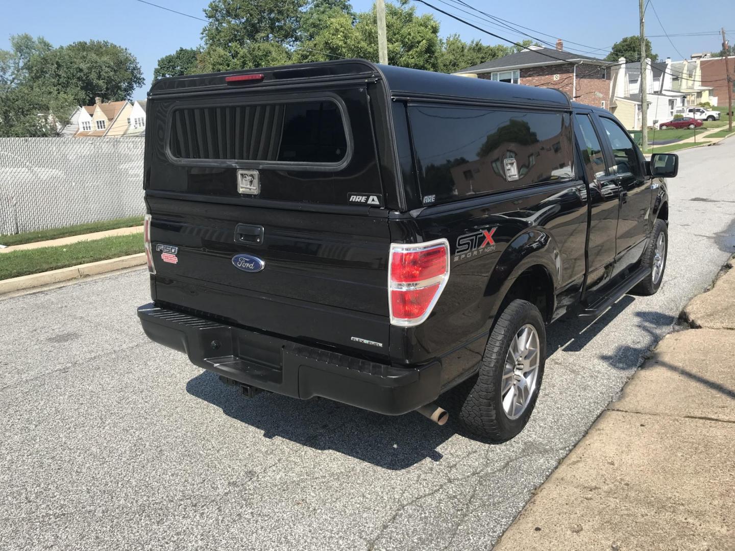 2014 /Black Ford F-150 STX SuperCab 6.5-ft. Bed 4WD (1FTEX1EM8EK) with an 3.7L V6 DOHC 24V engine, 6-Speed Automatic transmission, located at 577 Chester Pike, Prospect Park, PA, 19076, (610) 237-1015, 39.886154, -75.302338 - 2014 Ford F150 STX: Extended cab (3-door), 4x4, bed cap with side access, trailer hitch, new PA inspection, runs LIKE NEW! This vehicle comes inspected and has been given a bumper to bumper safety check. It is very clean, reliable, and well maintained. We offer a unique pay plan that is known for - Photo#5