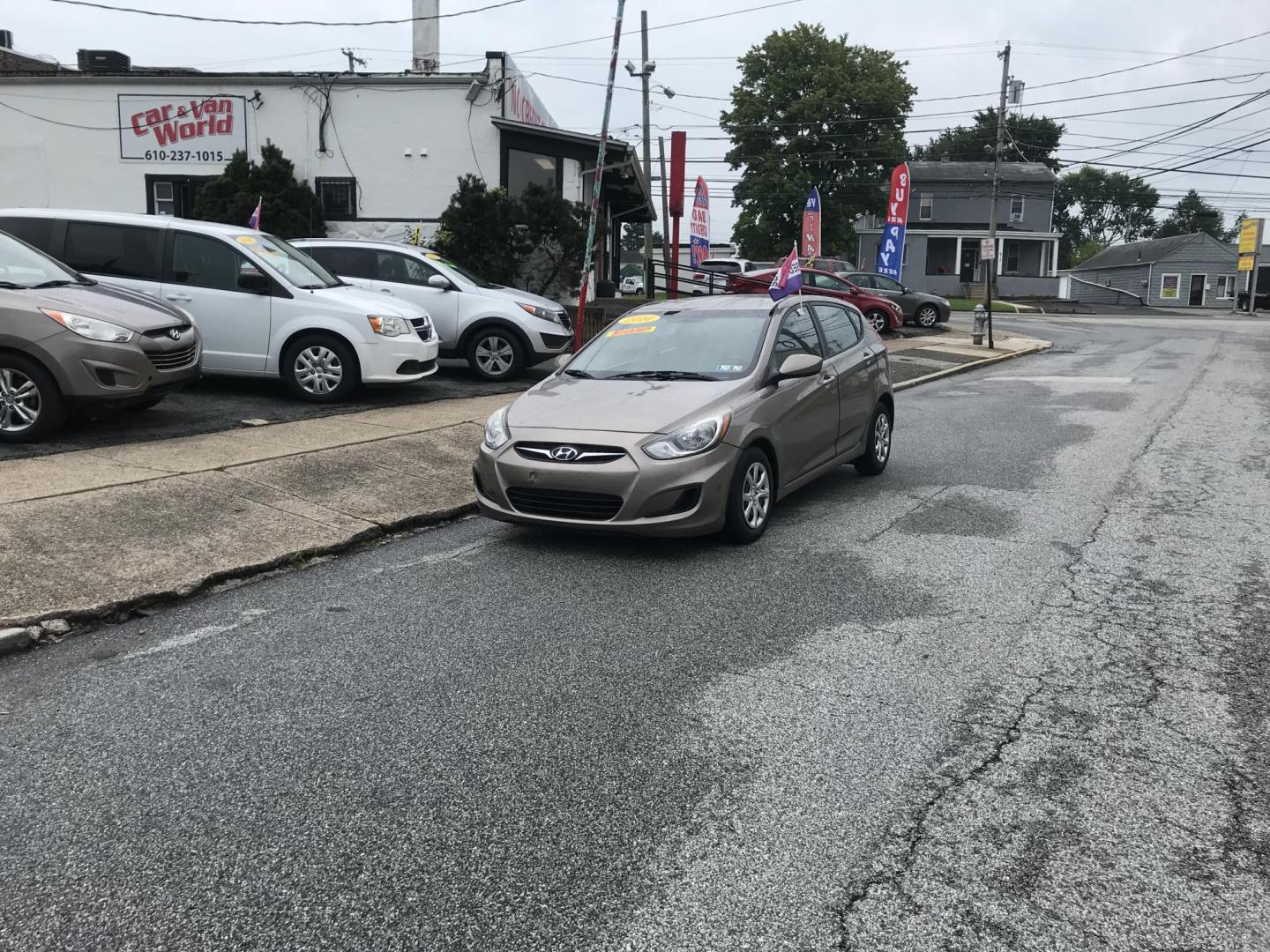 2014 Gold /Tan Hyundai Accent GS 5-Door (KMHCT5AE9EU) with an 1.6L L4 DOHC 16V engine, Automatic transmission, located at 577 Chester Pike, Prospect Park, PA, 19076, (610) 237-1015, 39.886154, -75.302338 - Photo#2