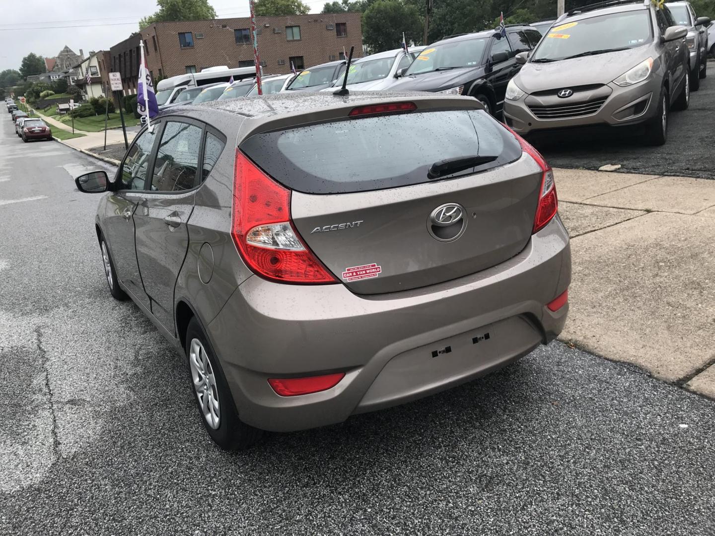 2014 Gold /Tan Hyundai Accent GS 5-Door (KMHCT5AE9EU) with an 1.6L L4 DOHC 16V engine, Automatic transmission, located at 577 Chester Pike, Prospect Park, PA, 19076, (610) 237-1015, 39.886154, -75.302338 - Photo#5