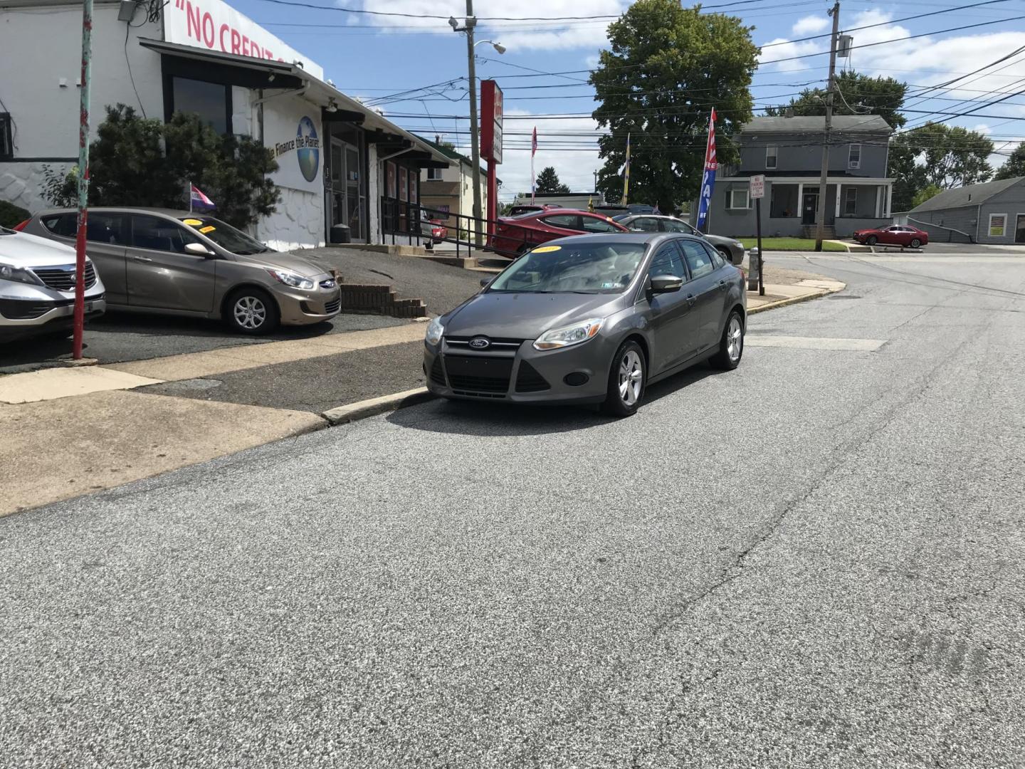 2013 Gray /Gray Ford Focus SE Sedan (1FADP3F2XDL) with an 2.0L L4 DOHC 16V engine, Automatic transmission, located at 577 Chester Pike, Prospect Park, PA, 19076, (610) 237-1015, 39.886154, -75.302338 - 2013 Ford Focus: Only 93k miles, great on gas, new PA inspection, runs LIKE NEW! This vehicle comes inspected and has been given a bumper to bumper safety check. It is very clean, reliable, and well maintained. We offer a unique pay plan that is known for being the easiest and fastest financing o - Photo#1