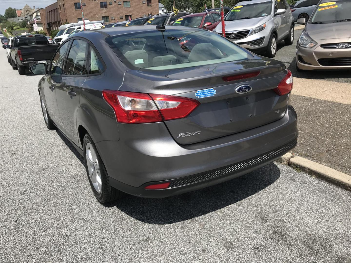 2013 Gray /Gray Ford Focus SE Sedan (1FADP3F2XDL) with an 2.0L L4 DOHC 16V engine, Automatic transmission, located at 577 Chester Pike, Prospect Park, PA, 19076, (610) 237-1015, 39.886154, -75.302338 - 2013 Ford Focus: Only 93k miles, great on gas, new PA inspection, runs LIKE NEW! This vehicle comes inspected and has been given a bumper to bumper safety check. It is very clean, reliable, and well maintained. We offer a unique pay plan that is known for being the easiest and fastest financing o - Photo#4