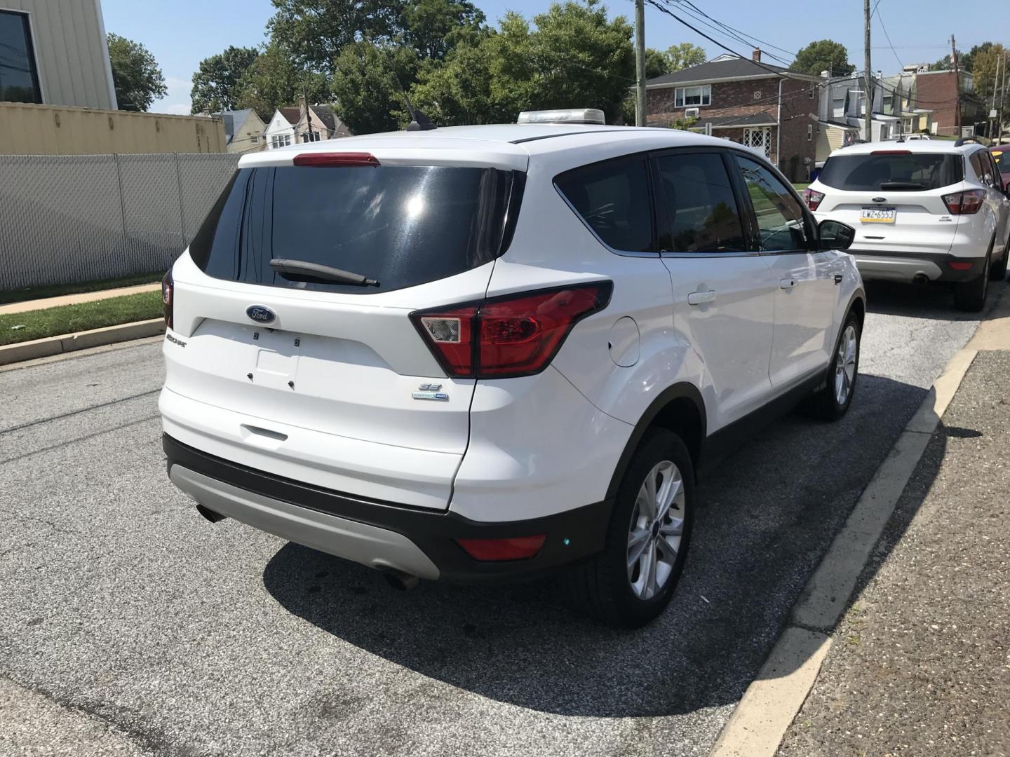 2019 White /Gray Ford Escape SE 4WD (1FMCU9GD6KU) with an 1.5L L4 DOHC 16V engine, 6A transmission, located at 577 Chester Pike, Prospect Park, PA, 19076, (610) 237-1015, 39.886154, -75.302338 - 2019 Ford Escape: Only 116k miles, backup camera, 4x4, new PA inspection, SUPER CLEAN, runs LIKE NEW! This vehicle comes inspected and has been given a bumper to bumper safety check. It is very clean, reliable, and well maintained. We offer a unique pay plan that is known for being the easiest an - Photo#4