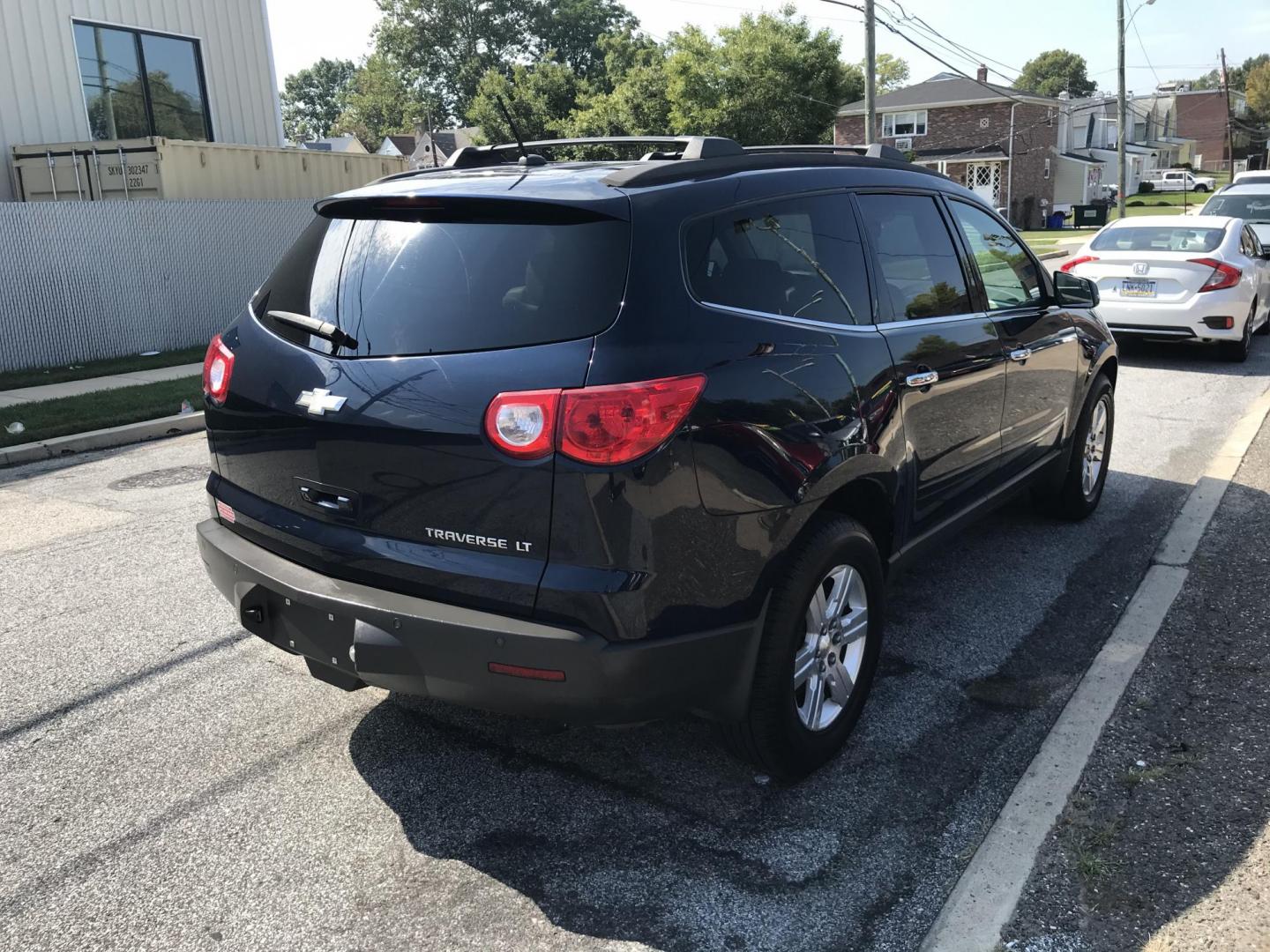 2010 Blue /Tan Chevrolet Traverse LT1 FWD (1GNLRGED1AJ) with an 3.6L V6 DOHC 24V engine, 6-Speed Automatic transmission, located at 577 Chester Pike, Prospect Park, PA, 19076, (610) 237-1015, 39.886154, -75.302338 - Photo#3