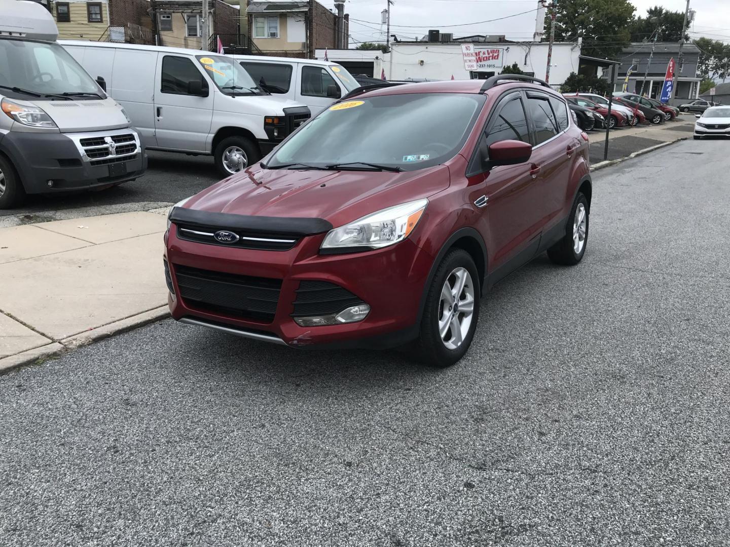 2016 Red /Gray Ford Escape SE 4WD (1FMCU9GX4GU) with an 1.6L L4 DOHC 16V engine, 6-Speed Automatic transmission, located at 577 Chester Pike, Prospect Park, PA, 19076, (610) 237-1015, 39.886154, -75.302338 - Photo#3