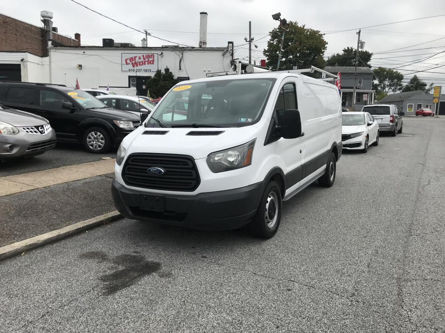 2015 White /Gray Ford Transit 150 Van Low Roof w/Sliding Pass. 130-in. WB (1FTNE1YM7FK) with an 3.7L V6 DOHC 24V engine, 6-Speed Automatic transmission, located at 577 Chester Pike, Prospect Park, PA, 19076, (610) 237-1015, 39.886154, -75.302338 - 2015 Ford Transit 150 Low Roof: Only 135k miles, ladder racks, multiple pieces of shelving, partition, new PA inspection, FLEET MAINTAINED, runs LIKE NEW! This vehicle comes inspected and has been given a bumper to bumper safety check. It is very clean, reliable, and well maintained. We offer a u - Photo#1