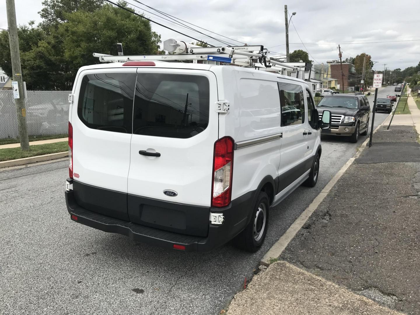 2015 White /Gray Ford Transit 150 Van Low Roof w/Sliding Pass. 130-in. WB (1FTNE1YM7FK) with an 3.7L V6 DOHC 24V engine, 6-Speed Automatic transmission, located at 577 Chester Pike, Prospect Park, PA, 19076, (610) 237-1015, 39.886154, -75.302338 - 2015 Ford Transit 150 Low Roof: Only 135k miles, ladder racks, multiple pieces of shelving, partition, new PA inspection, FLEET MAINTAINED, runs LIKE NEW! This vehicle comes inspected and has been given a bumper to bumper safety check. It is very clean, reliable, and well maintained. We offer a u - Photo#4