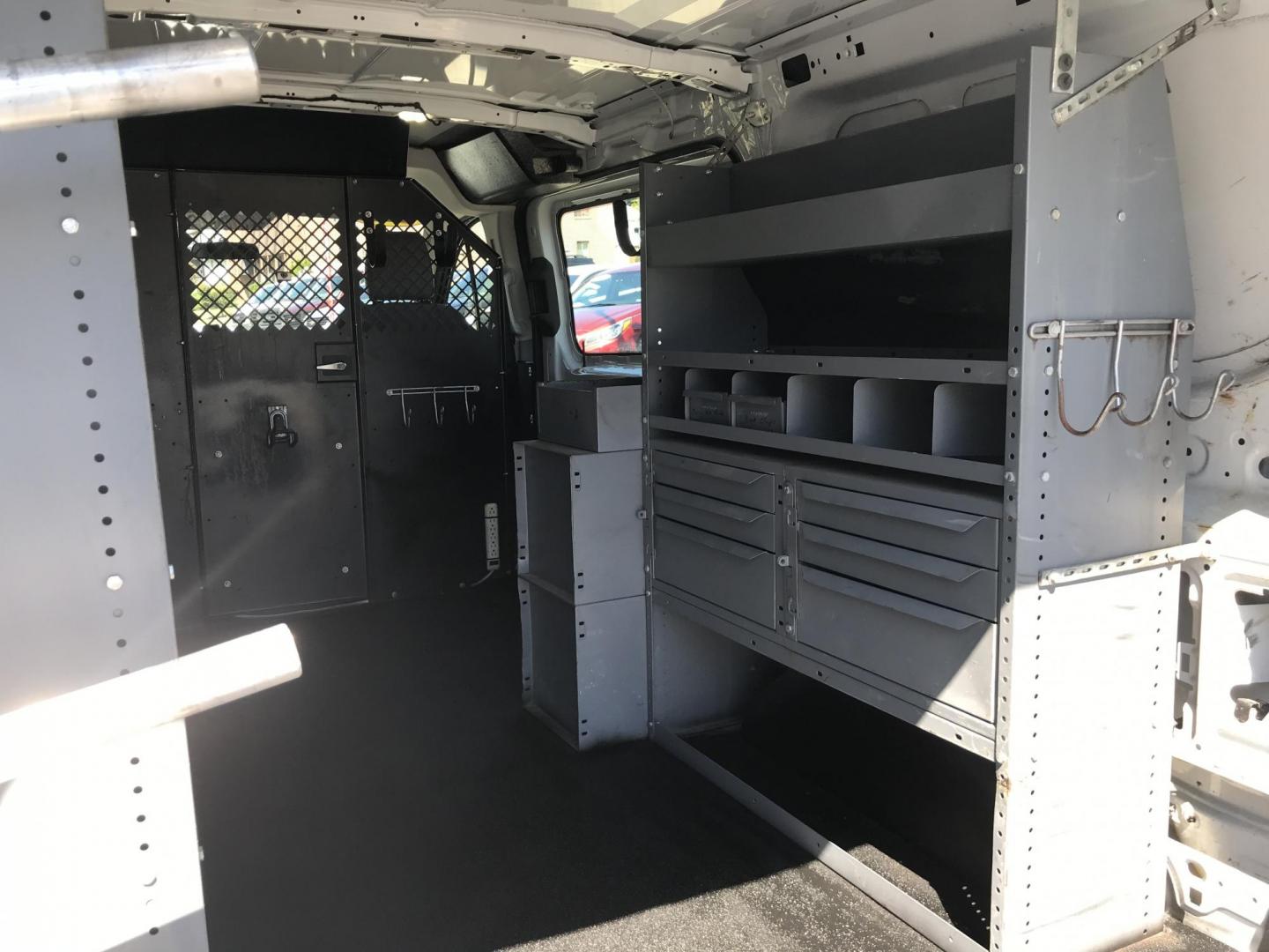 2015 White /Gray Ford Transit 150 Van Low Roof w/Sliding Pass. 130-in. WB (1FTNE1YM7FK) with an 3.7L V6 DOHC 24V engine, 6-Speed Automatic transmission, located at 577 Chester Pike, Prospect Park, PA, 19076, (610) 237-1015, 39.886154, -75.302338 - 2015 Ford Transit 150 Low Roof: Only 134k miles, drop down ladder racks, shelving, new PA inspection, partition, FLEET MAINTAINED! This vehicle comes inspected and has been given a bumper to bumper safety check. It is very clean, reliable, and well maintained. We offer a unique pay plan that is k - Photo#19