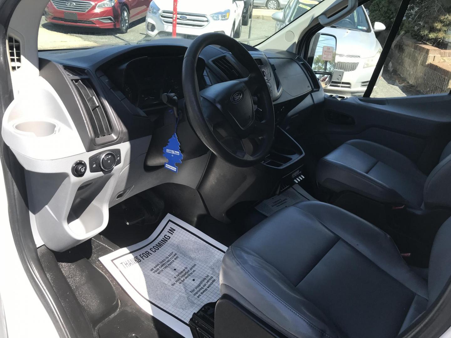 2015 White /Gray Ford Transit 150 Van Low Roof w/Sliding Pass. 130-in. WB (1FTNE1YM7FK) with an 3.7L V6 DOHC 24V engine, 6-Speed Automatic transmission, located at 577 Chester Pike, Prospect Park, PA, 19076, (610) 237-1015, 39.886154, -75.302338 - 2015 Ford Transit 150 Low Roof: Only 134k miles, drop down ladder racks, shelving, new PA inspection, partition, FLEET MAINTAINED! This vehicle comes inspected and has been given a bumper to bumper safety check. It is very clean, reliable, and well maintained. We offer a unique pay plan that is k - Photo#7