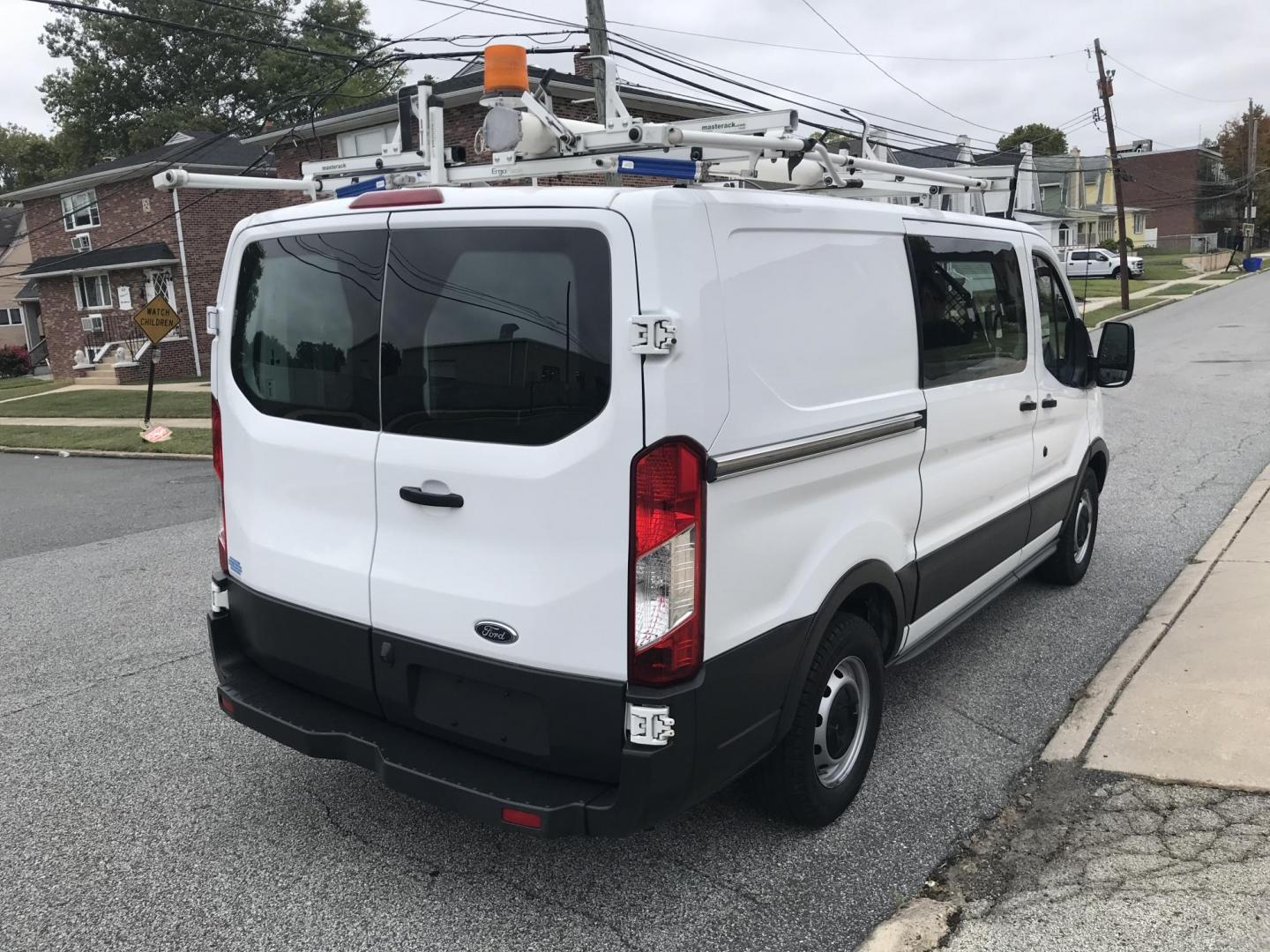 2016 White /Gray Ford Transit 150 Van Low Roof w/Sliding Pass. 130-in. WB (1FTYE1YM6GK) with an 3.7L V6 DOHC 24V engine, 6A transmission, located at 577 Chester Pike, Prospect Park, PA, 19076, (610) 237-1015, 39.886154, -75.302338 - Photo#4