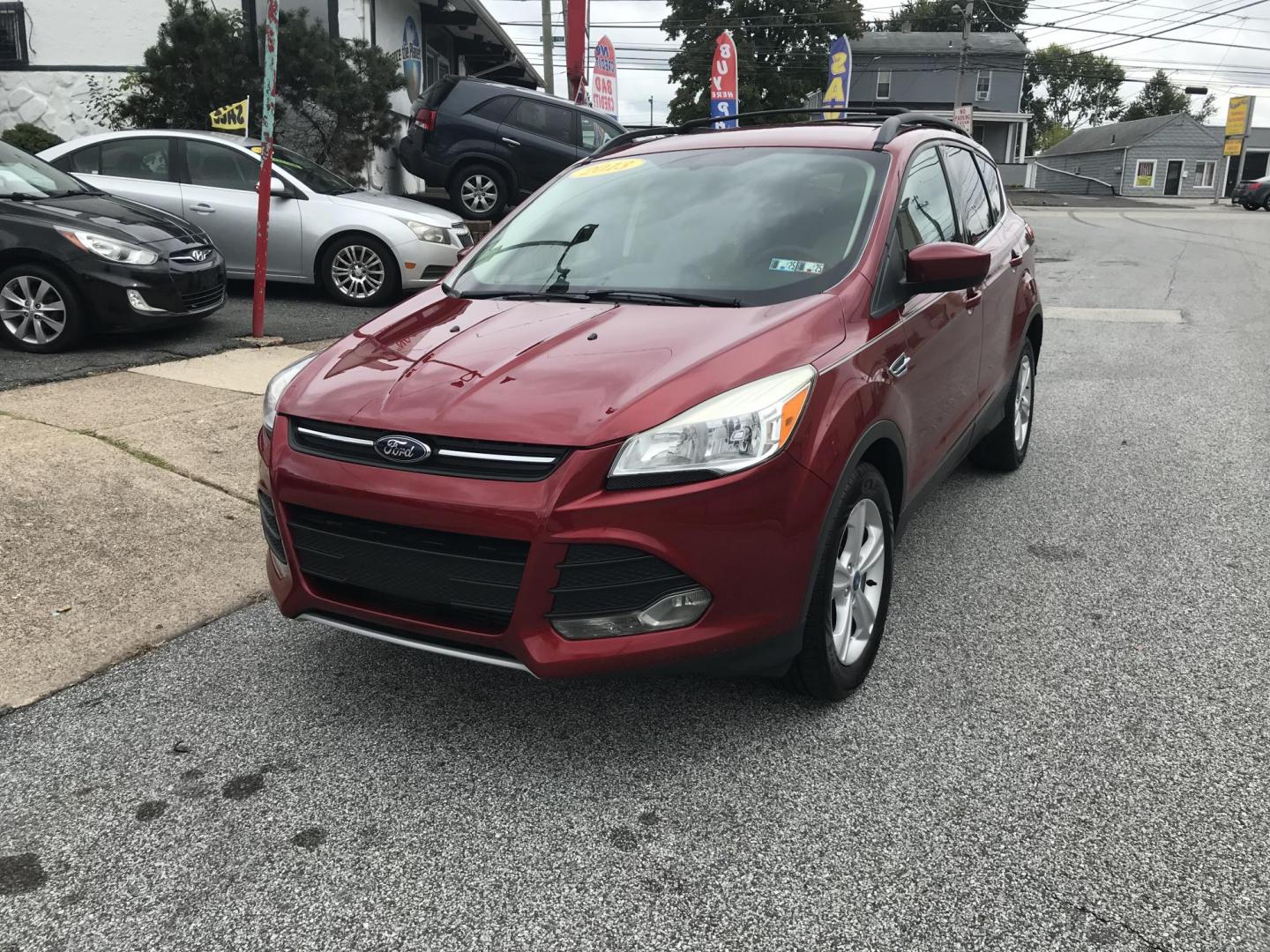 2013 Red /Tan Ford Escape SE AWD (1FMCU9GXXDU) with an 1.6L L4 DOHC 16V engine, 6-Speed Automatic transmission, located at 577 Chester Pike, Prospect Park, PA, 19076, (610) 237-1015, 39.886154, -75.302338 - 2013 Ford Escape SE: Only 110k miles, 4x4, new PA inspection, great on gas, runs LIKE NEW! This vehicle comes inspected and has been given a bumper to bumper safety check. It is very clean, reliable, and well maintained. We offer a unique pay plan that is known for being the easiest and fastest f - Photo#1