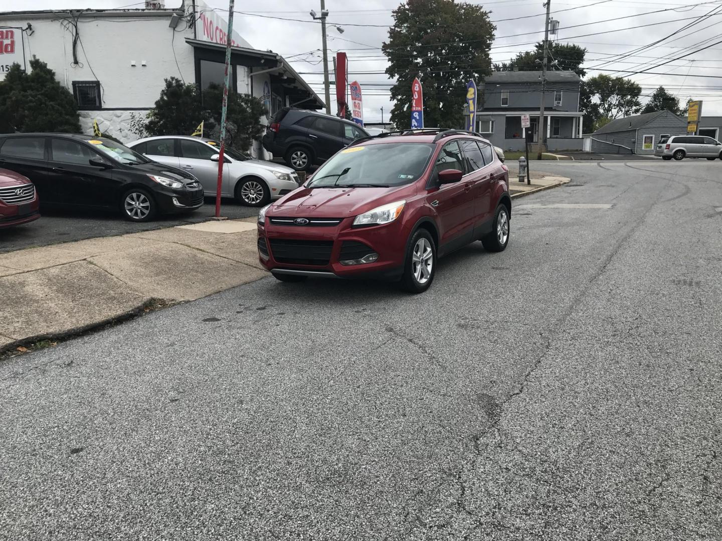 2013 Red /Tan Ford Escape SE AWD (1FMCU9GXXDU) with an 1.6L L4 DOHC 16V engine, 6-Speed Automatic transmission, located at 577 Chester Pike, Prospect Park, PA, 19076, (610) 237-1015, 39.886154, -75.302338 - 2013 Ford Escape SE: Only 110k miles, 4x4, new PA inspection, great on gas, runs LIKE NEW! This vehicle comes inspected and has been given a bumper to bumper safety check. It is very clean, reliable, and well maintained. We offer a unique pay plan that is known for being the easiest and fastest f - Photo#2