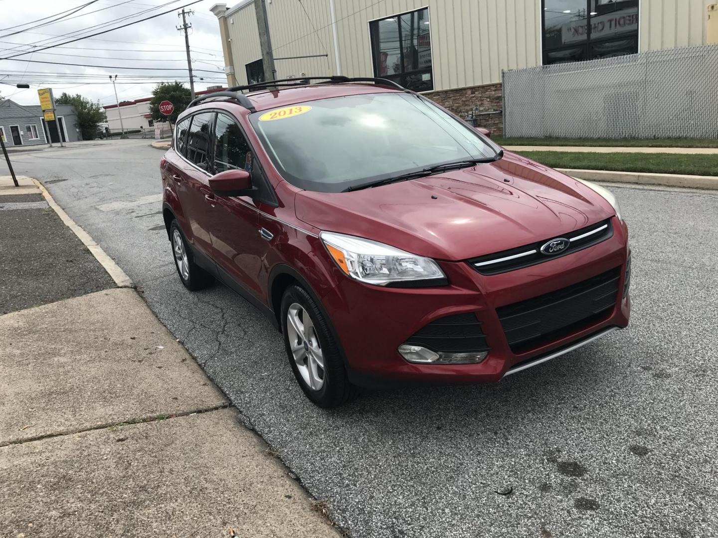 2013 Red /Tan Ford Escape SE AWD (1FMCU9GXXDU) with an 1.6L L4 DOHC 16V engine, 6-Speed Automatic transmission, located at 577 Chester Pike, Prospect Park, PA, 19076, (610) 237-1015, 39.886154, -75.302338 - 2013 Ford Escape SE: Only 110k miles, 4x4, new PA inspection, great on gas, runs LIKE NEW! This vehicle comes inspected and has been given a bumper to bumper safety check. It is very clean, reliable, and well maintained. We offer a unique pay plan that is known for being the easiest and fastest f - Photo#3