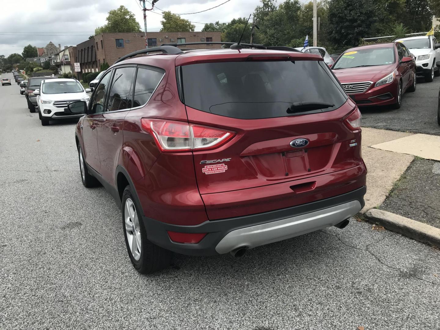 2013 Red /Tan Ford Escape SE AWD (1FMCU9GXXDU) with an 1.6L L4 DOHC 16V engine, 6-Speed Automatic transmission, located at 577 Chester Pike, Prospect Park, PA, 19076, (610) 237-1015, 39.886154, -75.302338 - 2013 Ford Escape SE: Only 110k miles, 4x4, new PA inspection, great on gas, runs LIKE NEW! This vehicle comes inspected and has been given a bumper to bumper safety check. It is very clean, reliable, and well maintained. We offer a unique pay plan that is known for being the easiest and fastest f - Photo#4