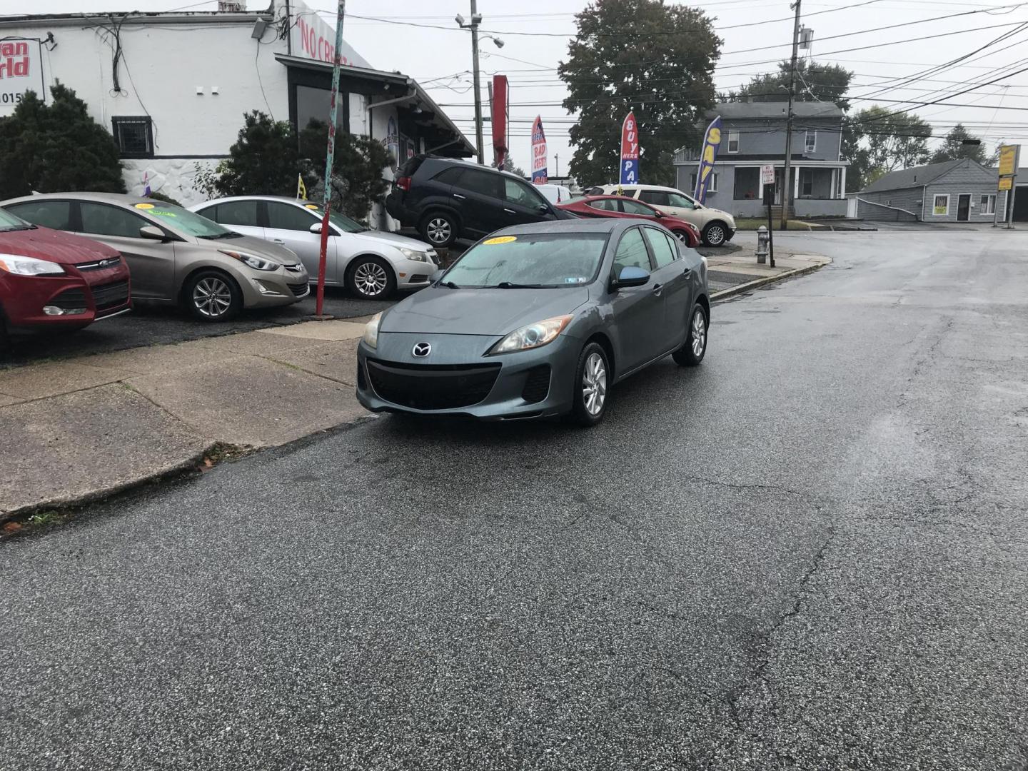 2012 Green /Gray Mazda MAZDA3 i Touring 4-Door (JM1BL1V87C1) with an 2.0L L4 DOHC 16V engine, Automatic transmission, located at 577 Chester Pike, Prospect Park, PA, 19076, (610) 237-1015, 39.886154, -75.302338 - 2012 Mazda 3 i Touring: Only 123k miles, great on gas, sunroof, new PA inspection, runs LIKE NEW! This vehicle comes inspected and has been given a bumper to bumper safety check. It is very clean, reliable, and well maintained. We offer a unique pay plan that is known for being the easiest and fa - Photo#1