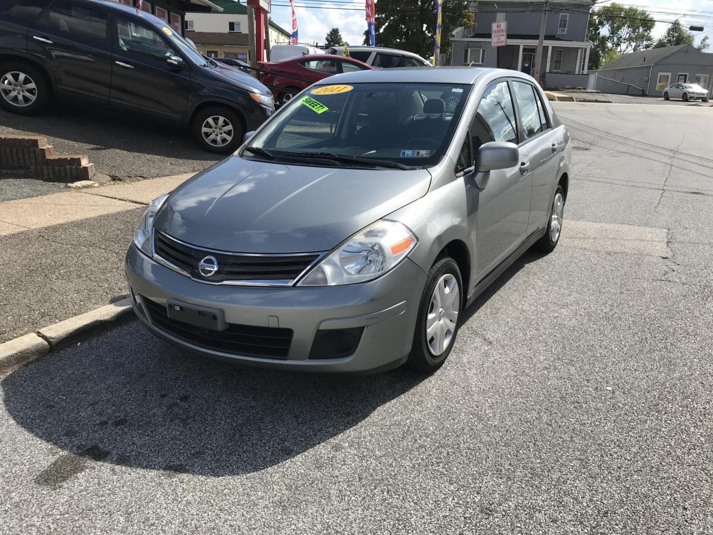 2011 Silver /Gray Nissan Versa 1.8 S Sedan (3N1BC1AP0BL) with an 1.8L L4 DOHC 16V engine, 4-Speed Aut transmission, located at 577 Chester Pike, Prospect Park, PA, 19076, (610) 237-1015, 39.886154, -75.302338 - Photo#2