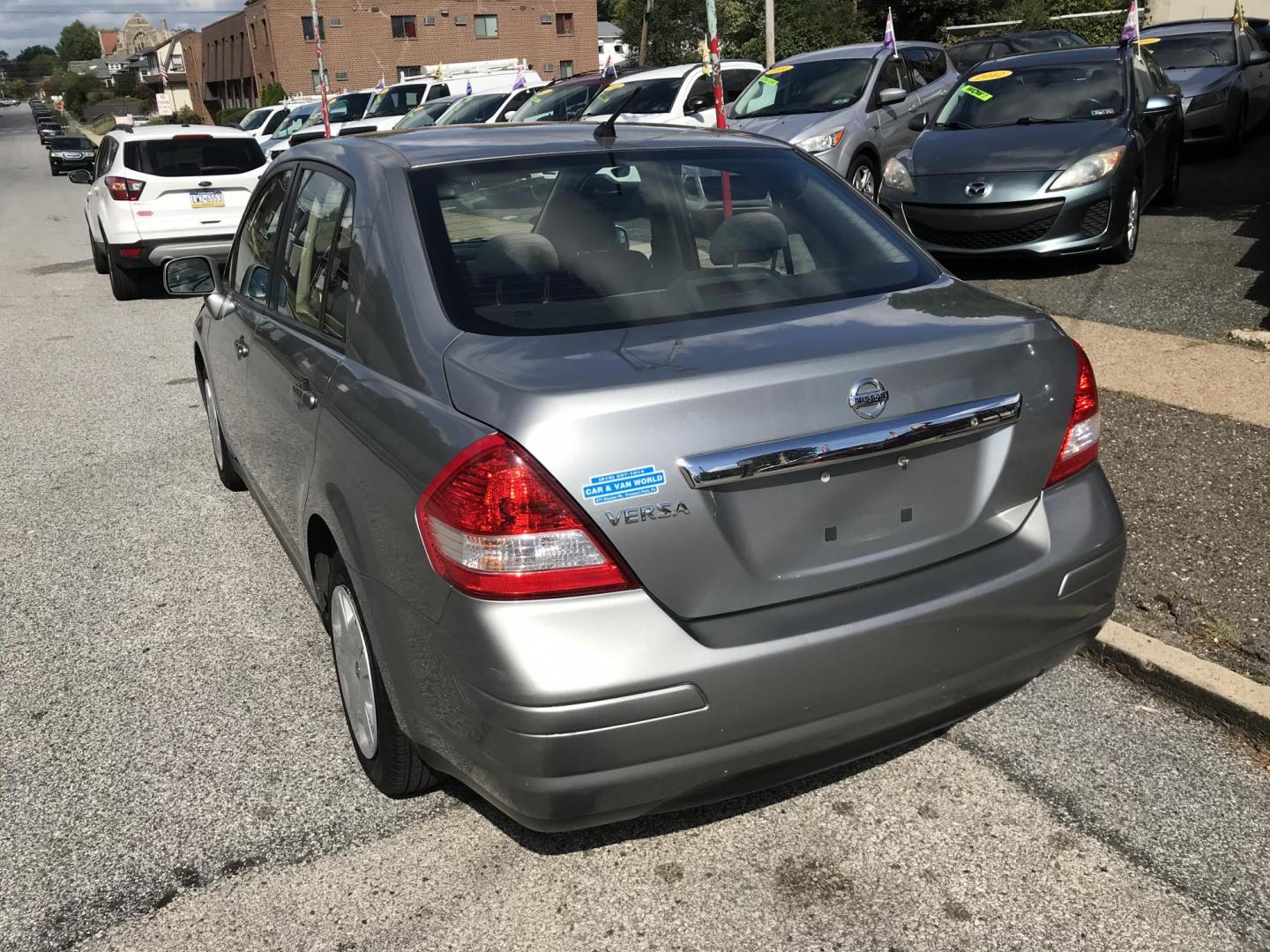 2011 Silver /Gray Nissan Versa 1.8 S Sedan (3N1BC1AP0BL) with an 1.8L L4 DOHC 16V engine, 4-Speed Aut transmission, located at 577 Chester Pike, Prospect Park, PA, 19076, (610) 237-1015, 39.886154, -75.302338 - Photo#5