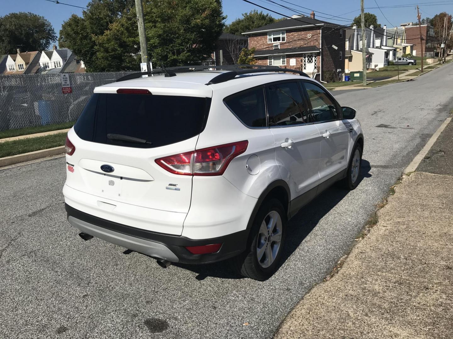 2013 White /Gray Ford Escape SE AWD (1FMCU9GX0DU) with an 1.6L L4 DOHC 16V engine, 6-Speed Automatic transmission, located at 577 Chester Pike, Prospect Park, PA, 19076, (610) 237-1015, 39.886154, -75.302338 - 2013 Ford Escape SE: All wheel drive, great on gas, new PA inspection, SUPER CLEAN! This vehicle comes inspected and has been given a bumper to bumper safety check. It is very clean, reliable, and well maintained. We offer a unique pay plan that is known for being the easiest and fastest financin - Photo#5