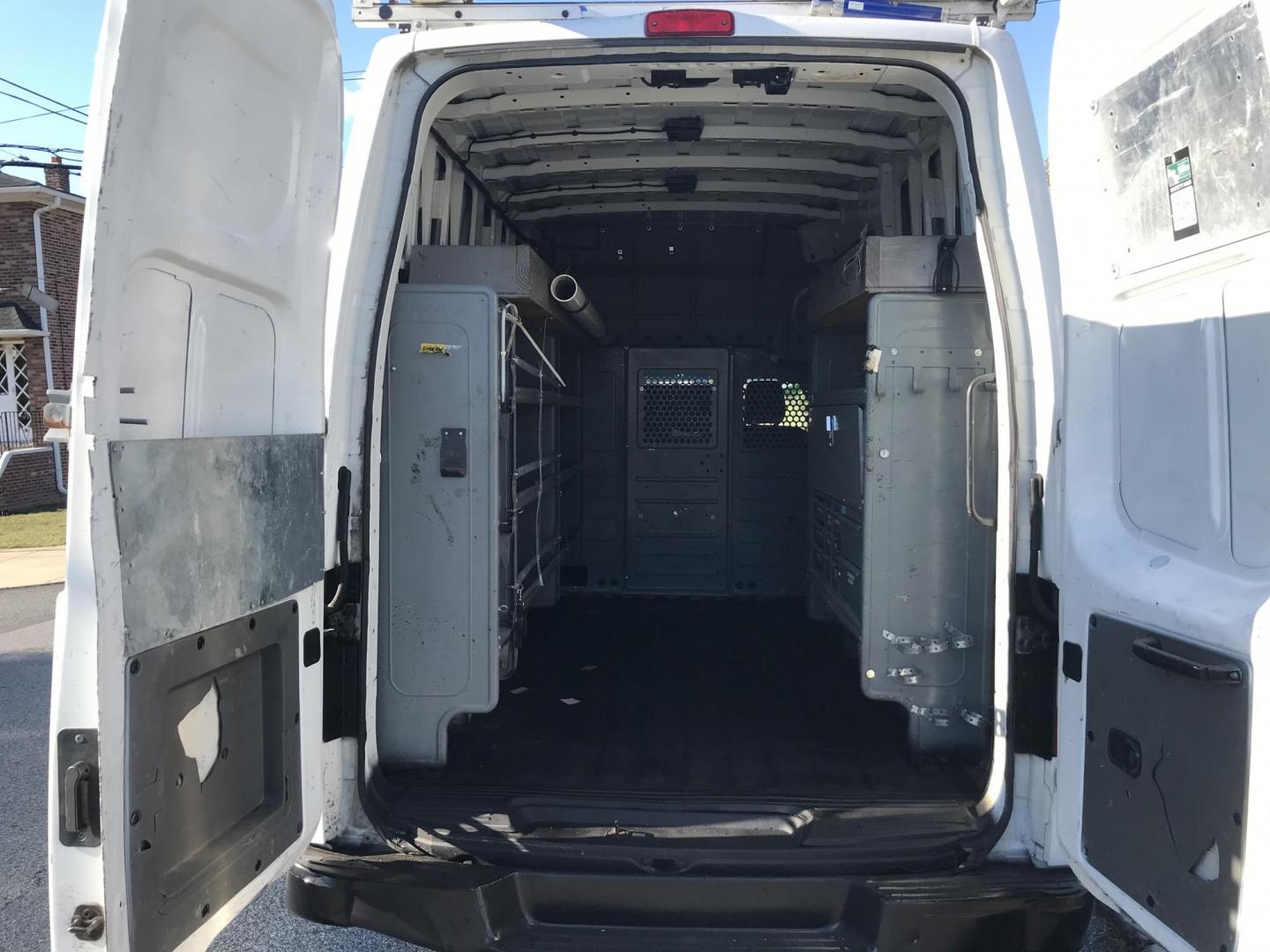 2015 White /Gray Nissan NV Cargo 2500 HD S V6 High Roof (1N6BF0LY6FN) with an 4.0L V6 engine, 5A transmission, located at 577 Chester Pike, Prospect Park, PA, 19076, (610) 237-1015, 39.886154, -75.302338 - 2015 Nissan NV 2500 High Roof: Only 139k miles, ladder racks, multiple pieces of shelving, partition, new PA inspection, FLEET MAINTAINED! This vehicle comes inspected and has been given a bumper to bumper safety check. It is very clean, reliable, and well maintained. We offer a unique pay plan t - Photo#13