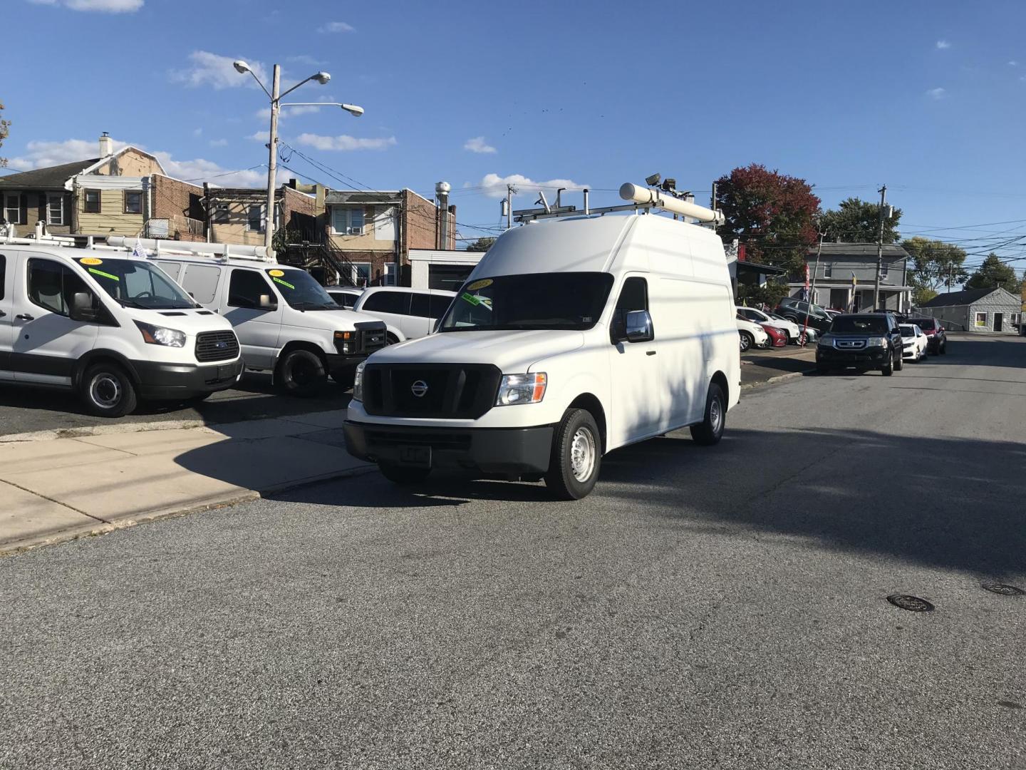 2015 White /Gray Nissan NV Cargo 2500 HD S V6 High Roof (1N6BF0LY6FN) with an 4.0L V6 engine, 5A transmission, located at 577 Chester Pike, Prospect Park, PA, 19076, (610) 237-1015, 39.886154, -75.302338 - 2015 Nissan NV 2500 High Roof: Only 139k miles, ladder racks, multiple pieces of shelving, partition, new PA inspection, FLEET MAINTAINED! This vehicle comes inspected and has been given a bumper to bumper safety check. It is very clean, reliable, and well maintained. We offer a unique pay plan t - Photo#2