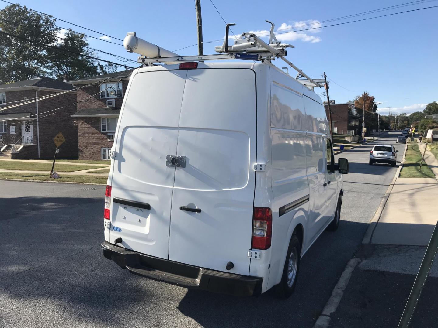 2015 White /Gray Nissan NV Cargo 2500 HD S V6 High Roof (1N6BF0LY6FN) with an 4.0L V6 engine, 5A transmission, located at 577 Chester Pike, Prospect Park, PA, 19076, (610) 237-1015, 39.886154, -75.302338 - 2015 Nissan NV 2500 High Roof: Only 139k miles, ladder racks, multiple pieces of shelving, partition, new PA inspection, FLEET MAINTAINED! This vehicle comes inspected and has been given a bumper to bumper safety check. It is very clean, reliable, and well maintained. We offer a unique pay plan t - Photo#4