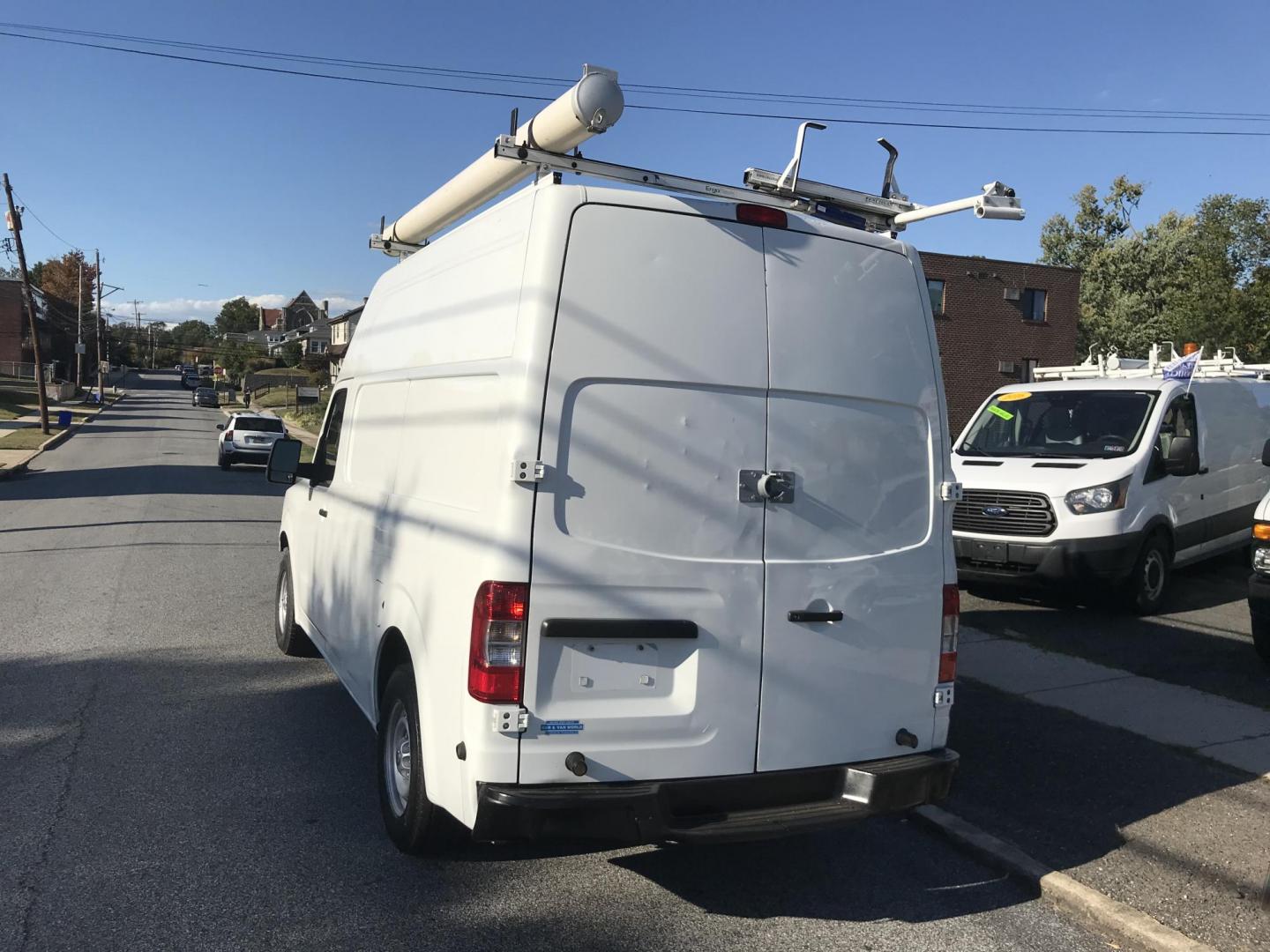 2015 White /Gray Nissan NV Cargo 2500 HD S V6 High Roof (1N6BF0LY6FN) with an 4.0L V6 engine, 5A transmission, located at 577 Chester Pike, Prospect Park, PA, 19076, (610) 237-1015, 39.886154, -75.302338 - 2015 Nissan NV 2500 High Roof: Only 139k miles, ladder racks, multiple pieces of shelving, partition, new PA inspection, FLEET MAINTAINED! This vehicle comes inspected and has been given a bumper to bumper safety check. It is very clean, reliable, and well maintained. We offer a unique pay plan t - Photo#5