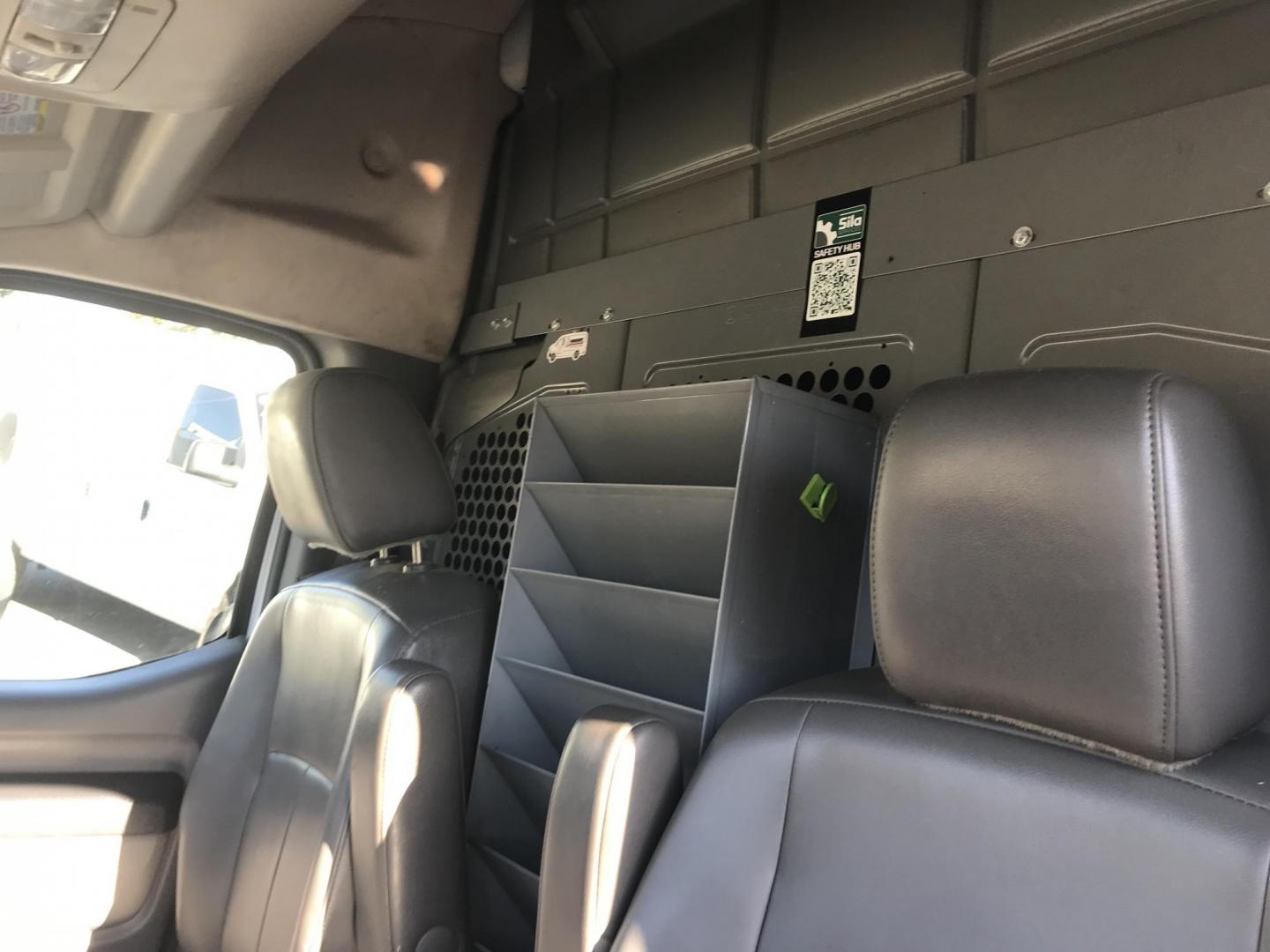 2015 White /Gray Nissan NV Cargo 2500 HD S V6 High Roof (1N6BF0LY6FN) with an 4.0L V6 engine, 5A transmission, located at 577 Chester Pike, Prospect Park, PA, 19076, (610) 237-1015, 39.886154, -75.302338 - 2015 Nissan NV 2500 High Roof: Only 139k miles, ladder racks, multiple pieces of shelving, partition, new PA inspection, FLEET MAINTAINED! This vehicle comes inspected and has been given a bumper to bumper safety check. It is very clean, reliable, and well maintained. We offer a unique pay plan t - Photo#7