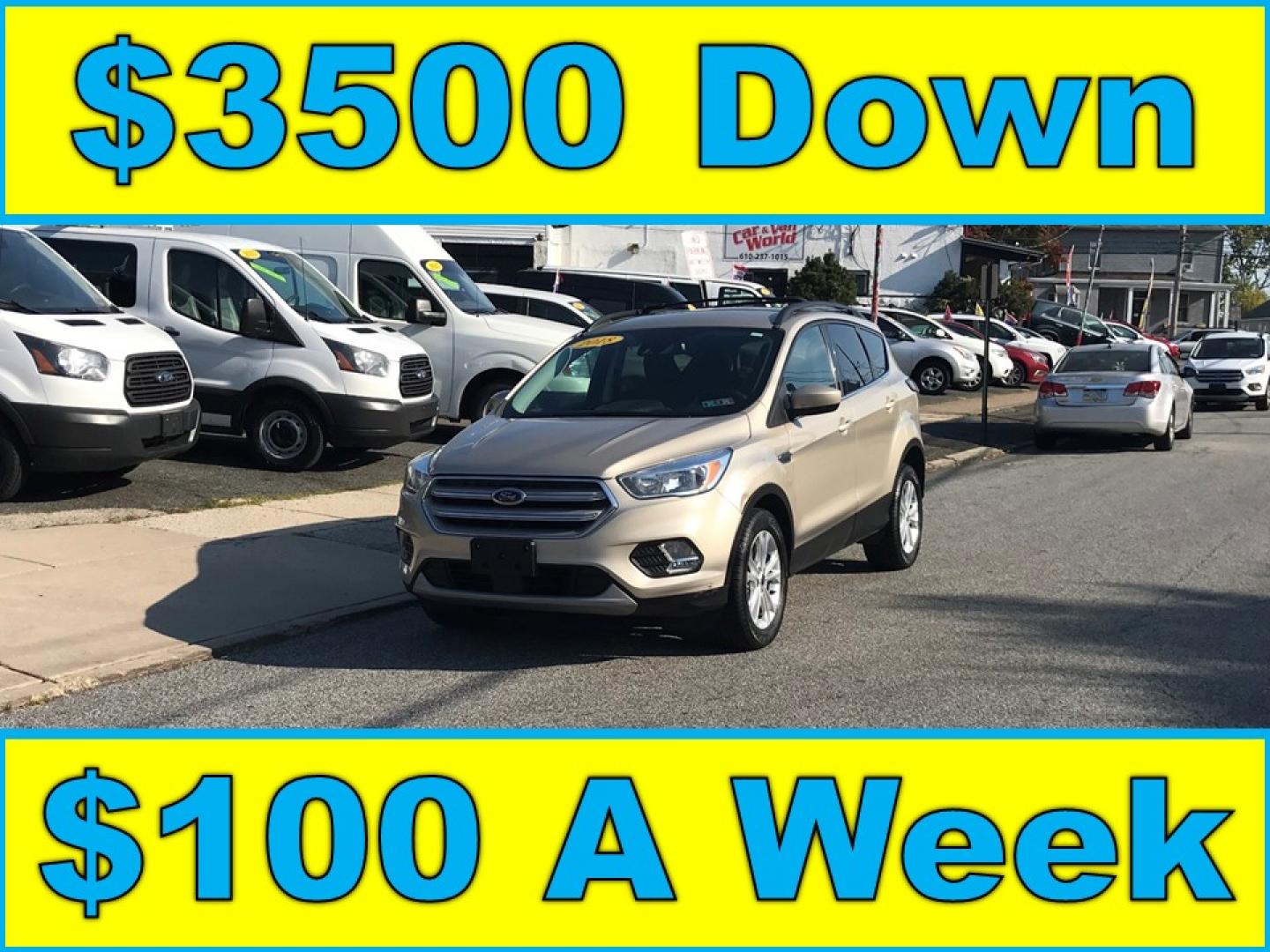 2018 Gold /Gray Ford Escape SE 4WD (1FMCU9GD5JU) with an 1.5L L4 DOHC 16V engine, 6A transmission, located at 577 Chester Pike, Prospect Park, PA, 19076, (610) 237-1015, 39.886154, -75.302338 - Photo#0