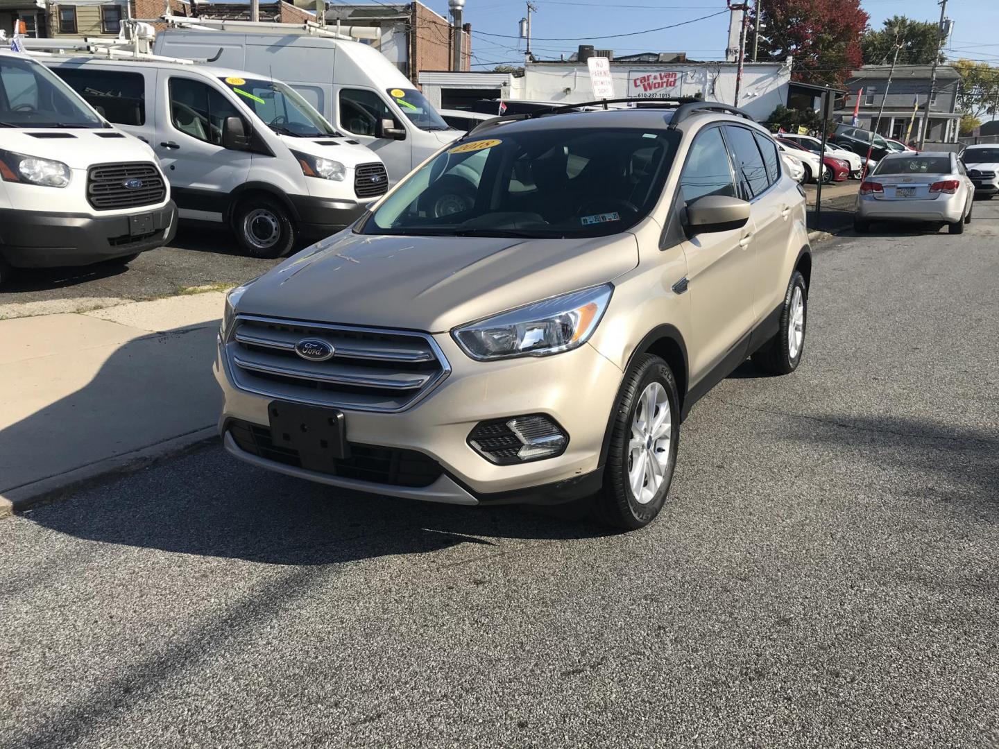 2018 Gold /Gray Ford Escape SE 4WD (1FMCU9GD5JU) with an 1.5L L4 DOHC 16V engine, 6A transmission, located at 577 Chester Pike, Prospect Park, PA, 19076, (610) 237-1015, 39.886154, -75.302338 - 2018 Ford Escape SE: 4x4, new PA inspection, backup camera, great on gas, runs LIKE NEW! This vehicle comes inspected and has been given a bumper to bumper safety check. It is very clean, reliable, and well maintained. We offer a unique pay plan that is known for being the easiest and fastest fin - Photo#3