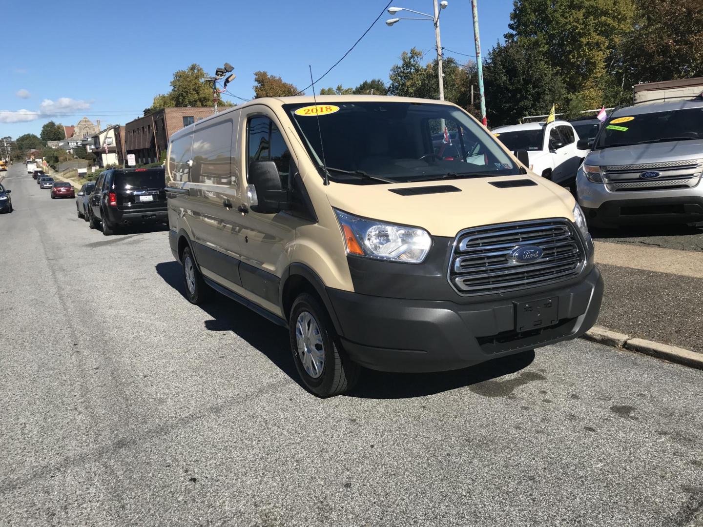 2018 Tan /Gray Ford Transit 150 Van Low Roof w/Sliding Pass. 130-in. WB (1FTYE1YM3JK) with an 3.7L V6 DOHC 24V engine, 6A transmission, located at 577 Chester Pike, Prospect Park, PA, 19076, (610) 237-1015, 39.886154, -75.302338 - Photo#1