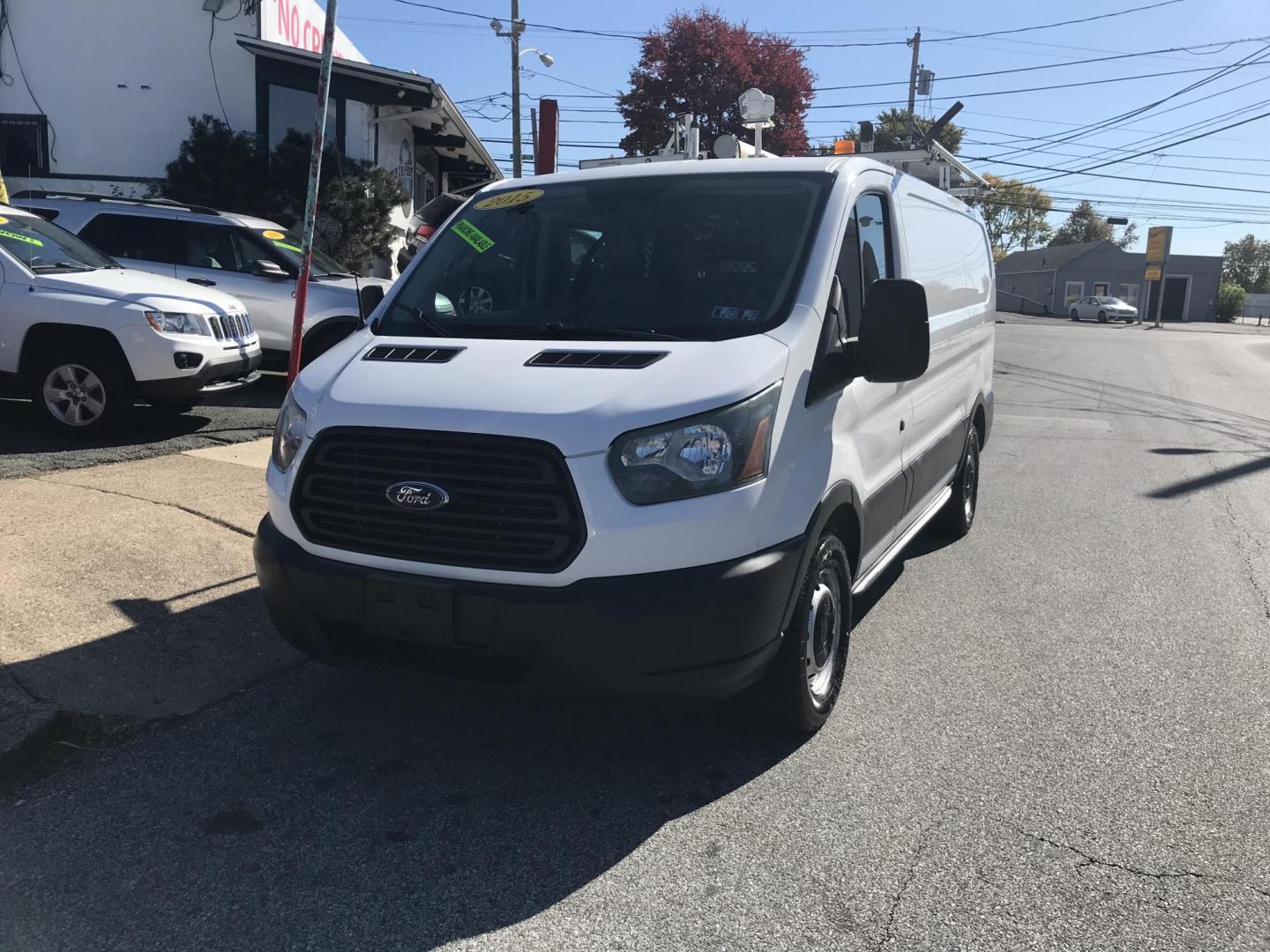 2015 White /Gray Ford Transit 150 Van Low Roof w/Sliding Pass. 130-in. WB (1FTNE1YM2FK) with an 3.7L V6 DOHC 24V engine, 6-Speed Automatic transmission, located at 577 Chester Pike, Prospect Park, PA, 19076, (610) 237-1015, 39.886154, -75.302338 - 2015 Ford Transit 150 Low Roof: Only 131k miles, drop down ladder racks, shelving, partition, new PA inspection, FLEET MAINTAINED, runs LIKE NEW! This vehicle comes inspected and has been given a bumper to bumper safety check. It is very clean, reliable, and well maintained. We offer a unique pay - Photo#1