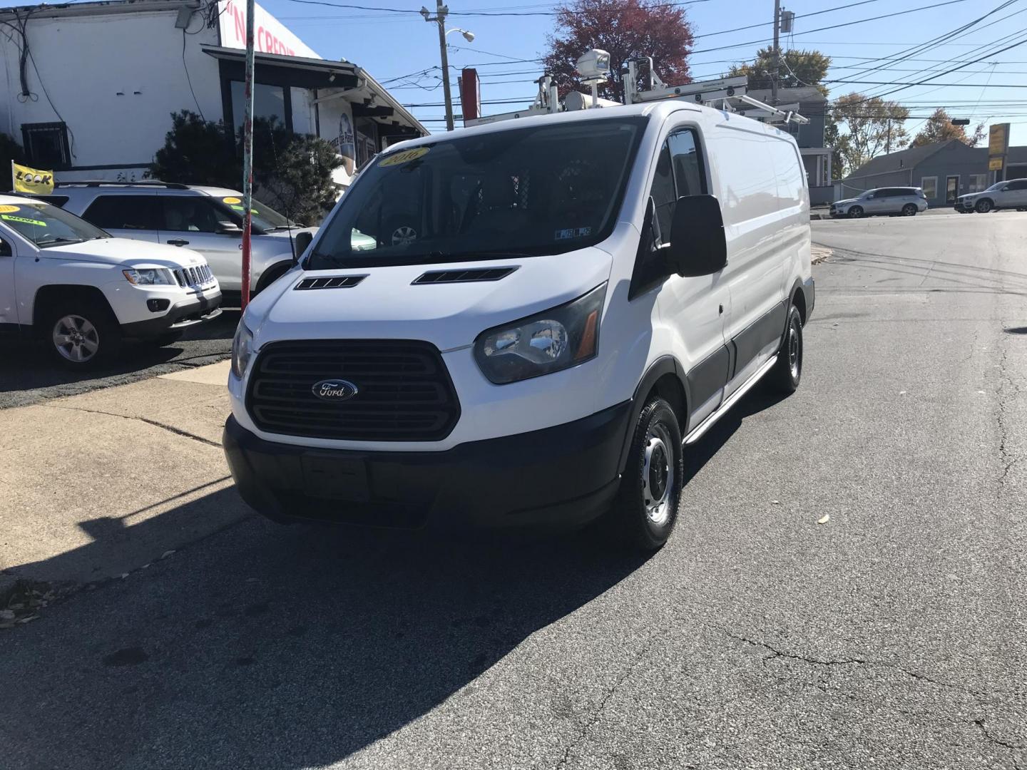 2016 White /Gray Ford Transit 150 Van Low Roof w/Sliding Pass. 130-in. WB (1FTYE1YM0GK) with an 3.7L V6 DOHC 24V engine, 6A transmission, located at 577 Chester Pike, Prospect Park, PA, 19076, (610) 237-1015, 39.886154, -75.302338 - 2016 Ford Transit 150 Low Roof: Only 138k miles, drop down ladder racks both sides, multiple pieces of shelving, backup camera, FLEET MAINTAINED, runs LIKE NEW! This vehicle comes inspected and has been given a bumper to bumper safety check. It is very clean, reliable, and well maintained. We off - Photo#1