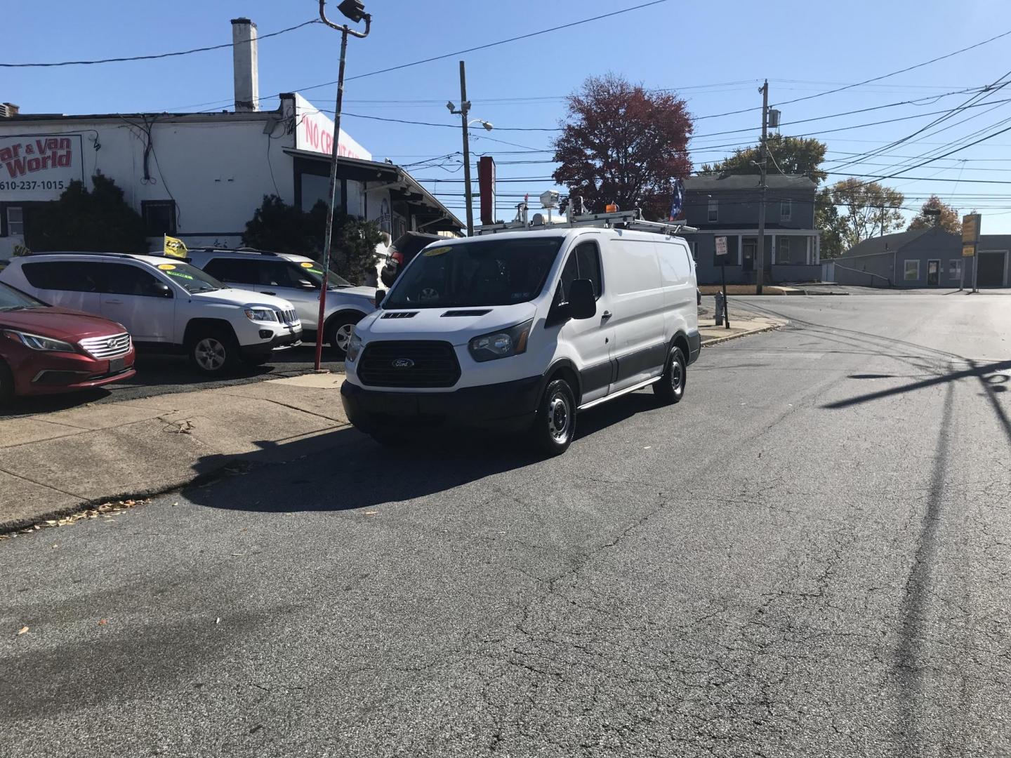 2016 White /Gray Ford Transit 150 Van Low Roof w/Sliding Pass. 130-in. WB (1FTYE1YM0GK) with an 3.7L V6 DOHC 24V engine, 6A transmission, located at 577 Chester Pike, Prospect Park, PA, 19076, (610) 237-1015, 39.886154, -75.302338 - 2016 Ford Transit 150 Low Roof: Only 138k miles, drop down ladder racks both sides, multiple pieces of shelving, backup camera, FLEET MAINTAINED, runs LIKE NEW! This vehicle comes inspected and has been given a bumper to bumper safety check. It is very clean, reliable, and well maintained. We off - Photo#2