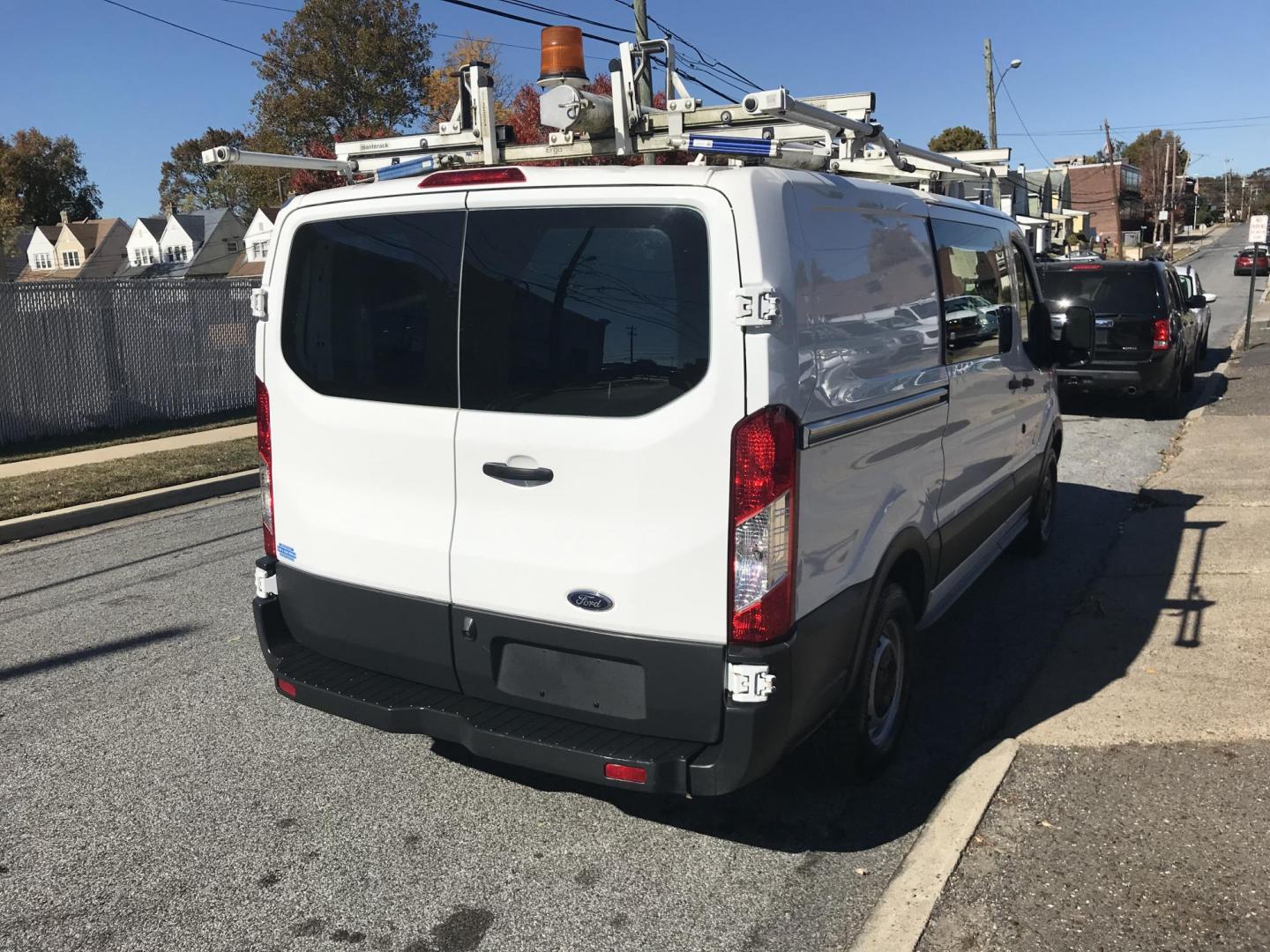 2016 White /Gray Ford Transit 150 Van Low Roof w/Sliding Pass. 130-in. WB (1FTYE1YM0GK) with an 3.7L V6 DOHC 24V engine, 6A transmission, located at 577 Chester Pike, Prospect Park, PA, 19076, (610) 237-1015, 39.886154, -75.302338 - 2016 Ford Transit 150 Low Roof: Only 138k miles, drop down ladder racks both sides, multiple pieces of shelving, backup camera, FLEET MAINTAINED, runs LIKE NEW! This vehicle comes inspected and has been given a bumper to bumper safety check. It is very clean, reliable, and well maintained. We off - Photo#4