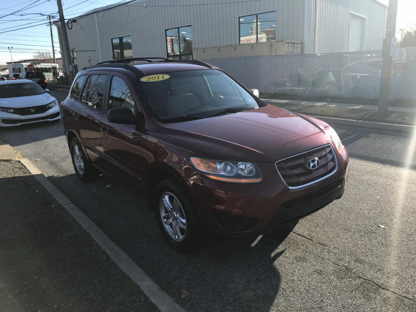 2011 Red /Tan Hyundai Santa Fe GLS 2.4 (5XYZG3AB8BG) with an 2.4L L4 DOHC 16V engine, 6-Speed Automatic transmission, located at 577 Chester Pike, Prospect Park, PA, 19076, (610) 237-1015, 39.886154, -75.302338 - 2011 Hyundai Santa Fe GL: Only 94k miles, new PA inspection, great on gas, runs LIKE NEW! This vehicle comes inspected and has been given a bumper to bumper safety check. It is very clean, reliable, and well maintained. We offer a unique pay plan that is known for being the easiest and fastest fi - Photo#3